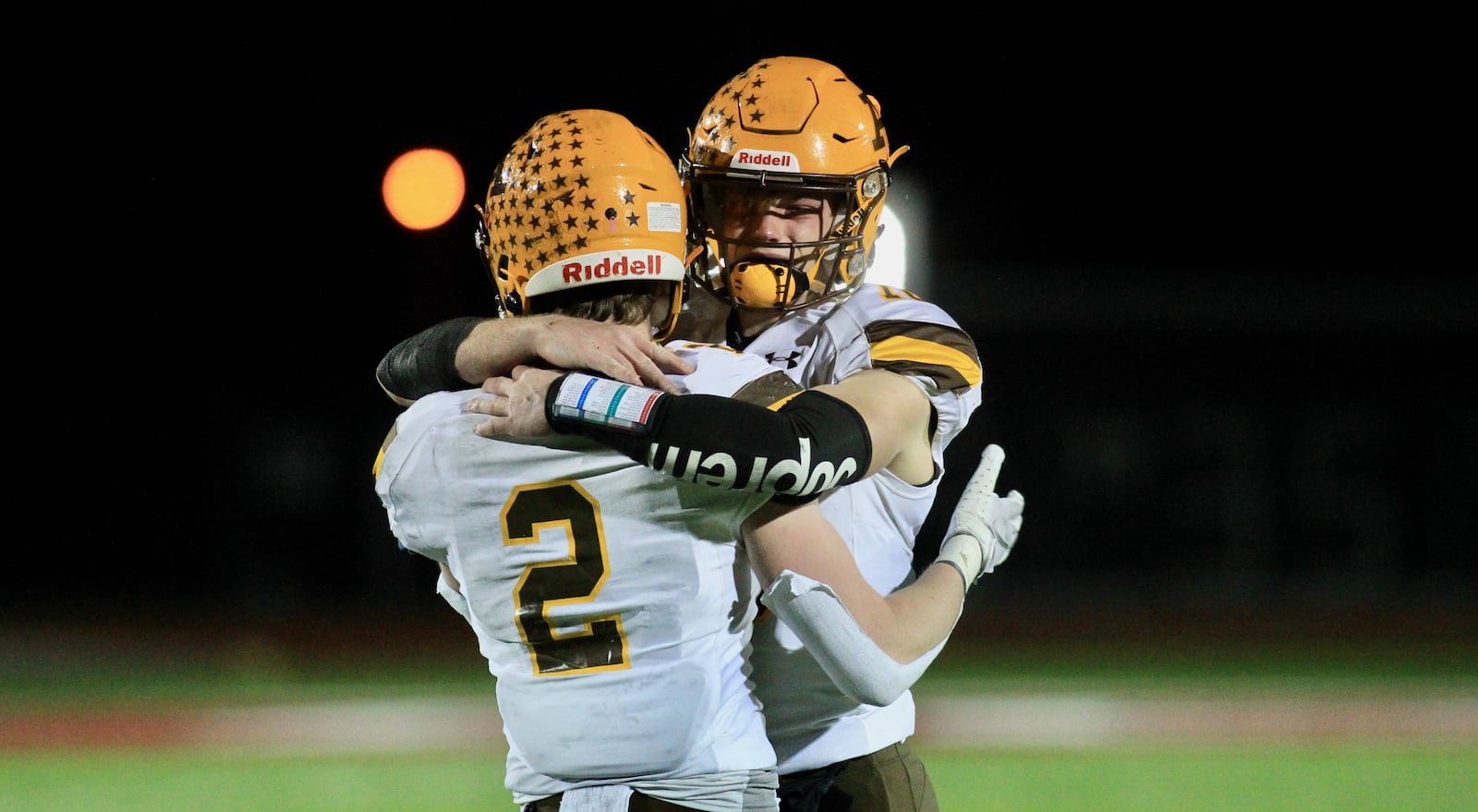 Alter's Aidan Plate, left, and Brian Shane hug after a loss to DeSales in a Division III state semifinal on Friday, Nov. 13, 2020, at London High School. David Jablonski/Staff