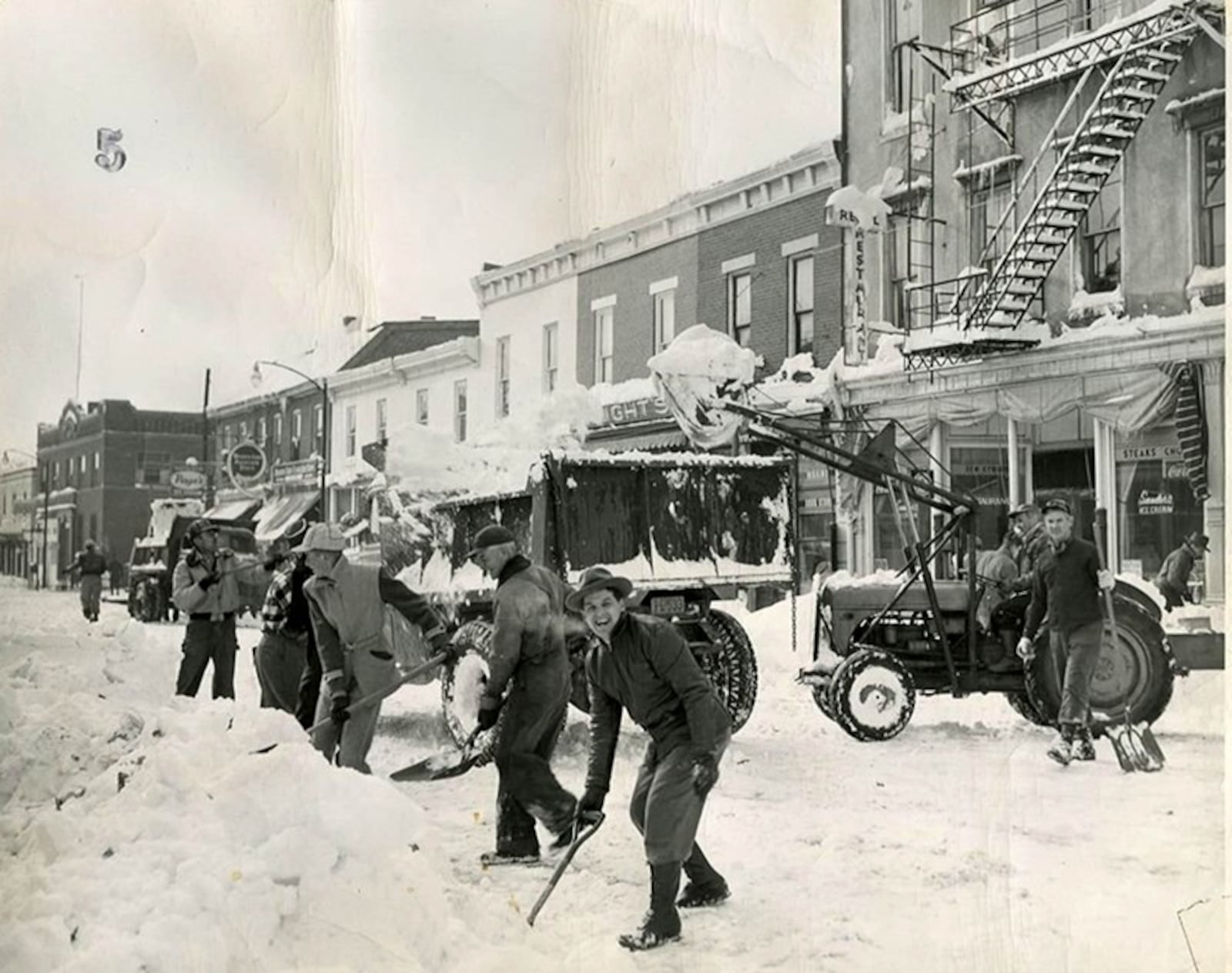 Bone-chilling cold accompanied the blizzard and created a run on department stores for woolen items, long underwear and flannel pajamas. A department store hosiery clerk received a call for fleece-lined women’s hose. People in Dayton had to work together to clear the roads and sidewalks.