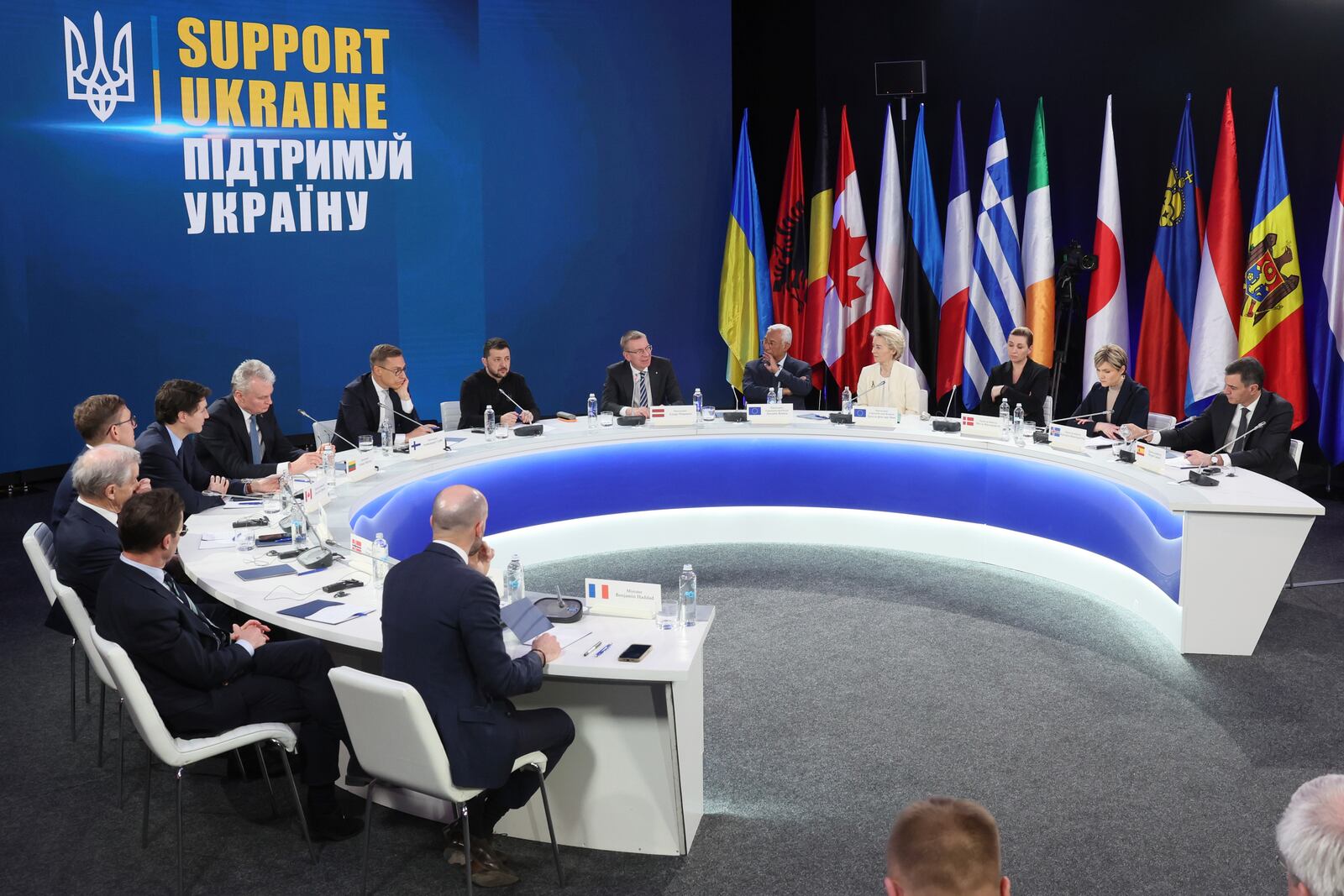 From second left by the table's sits: Sweden's Prime Minister Ulf Kristersson, Norway's Prime Minister Jonas Gahr Stoere, Estonia's Prime Minister Kristen Michal, Canada's Prime Minister Justin Trudeau, Lithuania's President Gitanas Nauseda, Finland's President Alexander Stubb, Ukrainian President Volodymyr Zelenskiy, Latvia's President Edgars Rinkevics, European Council President Antonio Costa, European Commission President Ursula von der Leyen, Denmark's Prime Minister Mette Frederiksen, Iceland's Prime Minister Kristrun Frostadottir, Spain's Prime Minister Pedro Sanchez attend a press conference after the "Support Ukraine" summit, marking the third anniversary of the Russian invasion, in Kyiv, Ukraine, Feb. 24, 2025. (Gleb Garanich/Pool Photo via AP)