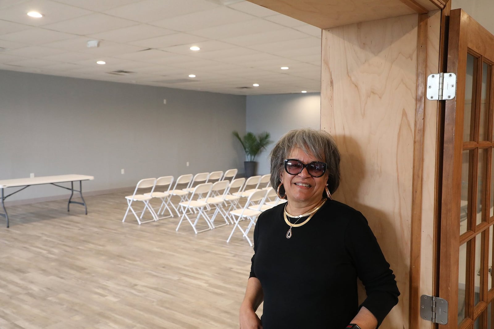 Sheila Lash Rice shows off one of the rooms in “The L”, a small banquet facility on South Yellow Springs Street. BILL LACKEY/STAFF