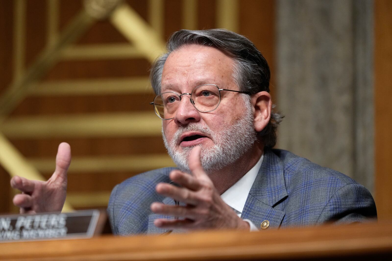 Ranking Member Gary Peters, D-Mich., speaks at the Senate Homeland Security and Governmental Affairs Committee confirmation hearing for South Dakota Gov. Kristi Noem, President-elect Donald Trump's nominee to be Secretary of Homeland Security, at the Capitol in Washington, Friday, Jan. 17, 2025. (AP Photo/Ben Curtis)