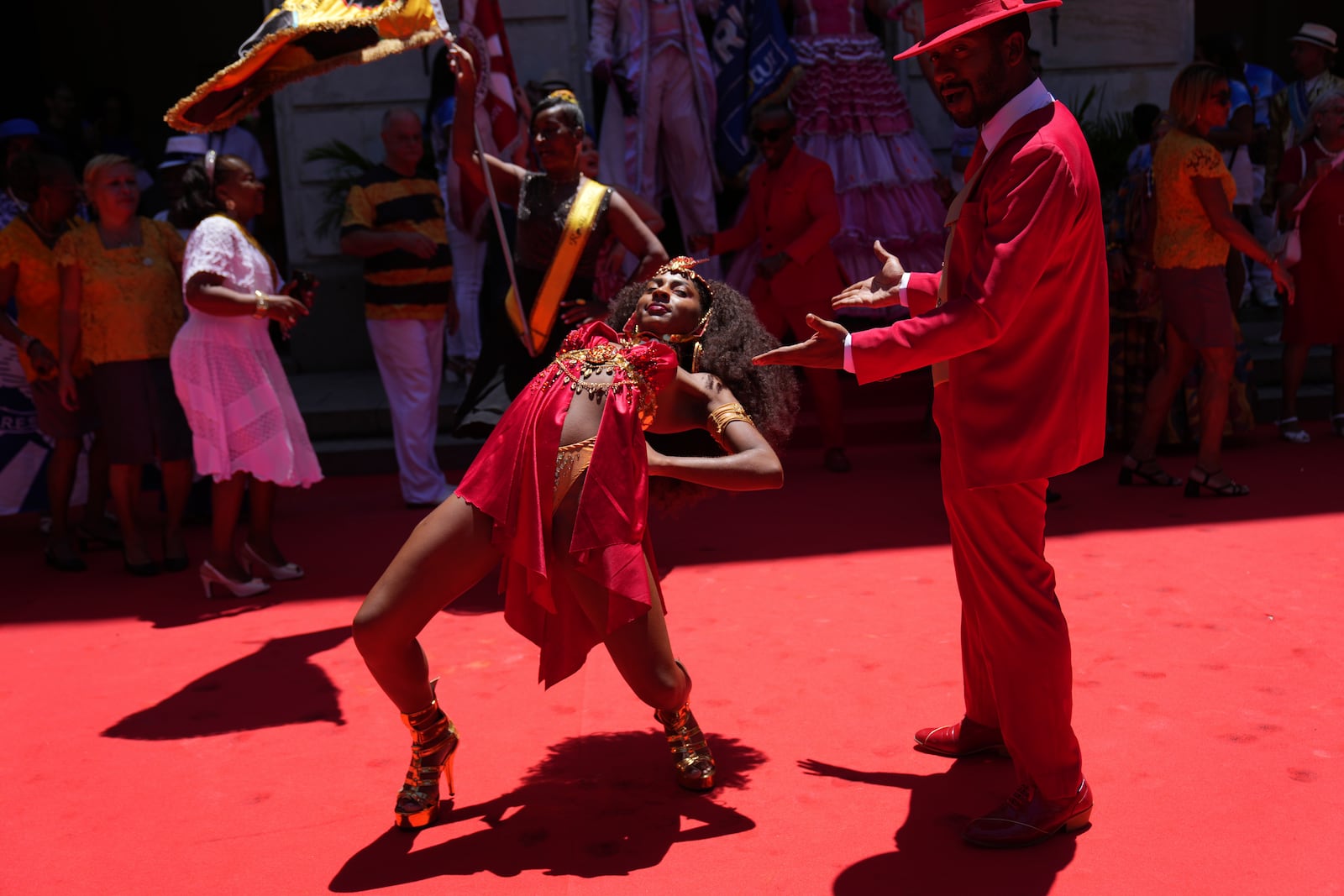 A couple performs at the ceremony to offically kick off Carnival in Rio de Janeiro, Brazil, Friday, Feb. 28, 2025. (AP Photo/Silvia Izquierdo)