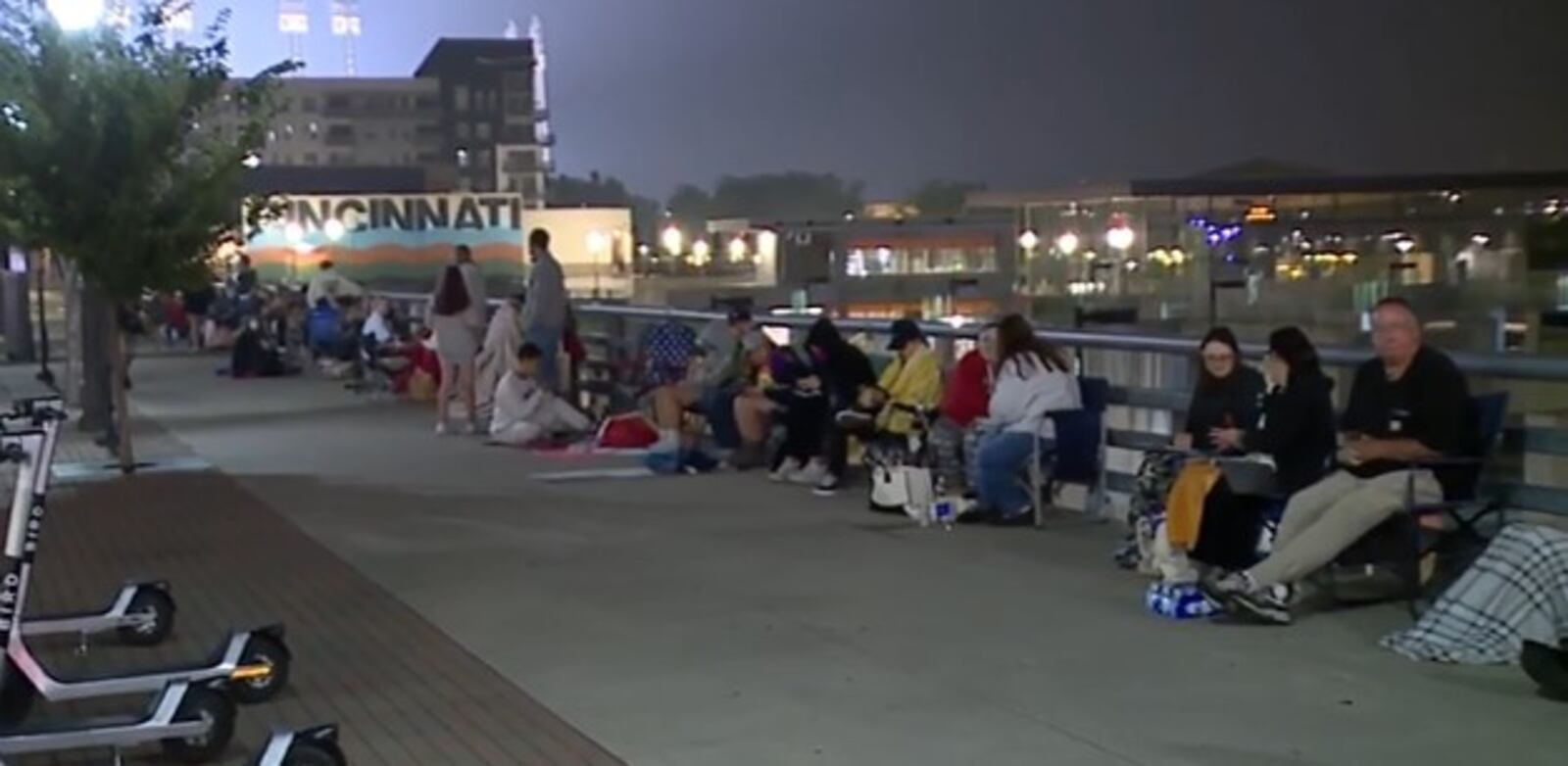 Fans line up at The Banks in downtown Cincinnati Thursday, June 29, 2023 as they await the opening of the Taylor Swift merchandise trailer, which rolled into town on Wednesday. WCPO/CONTRIBUTED