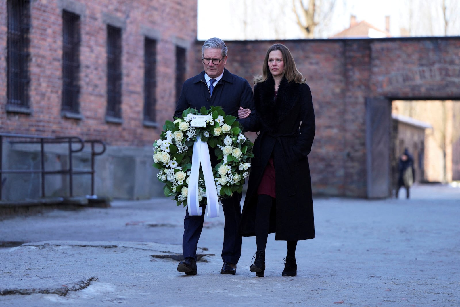 Britain's Prime Minister Keir Starmer and his wife Victoria Starmer visit the Memorial And Museum Auschwitz-Birkenau, a former Nazi German concentration and extermination camp, in Oswiecim, Poland, Friday Jan. 17, 2025. (Aleksandra Szmigiel/Pool via AP)