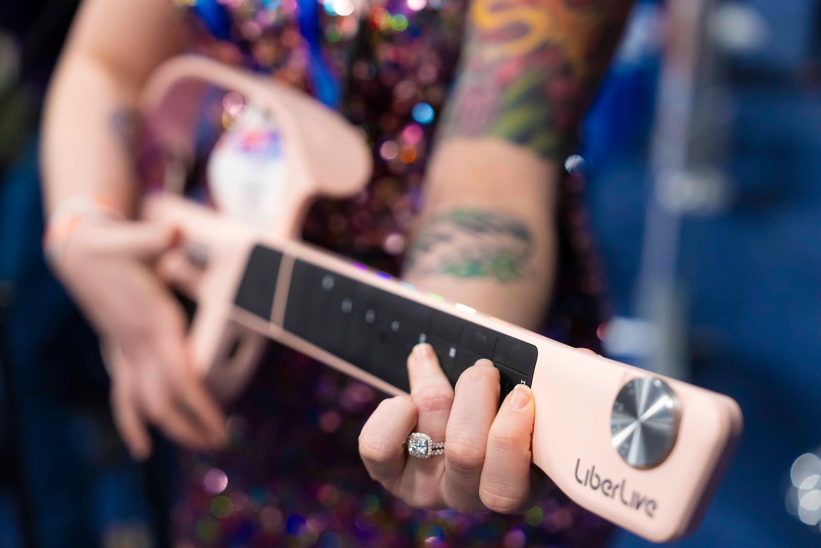 LiberLive showcases their stringless guitar at 2025 CES Unveiled, Sunday, Jan. 5, 2025, in Las Vegas. (AP Photo/Jack Dempsey)