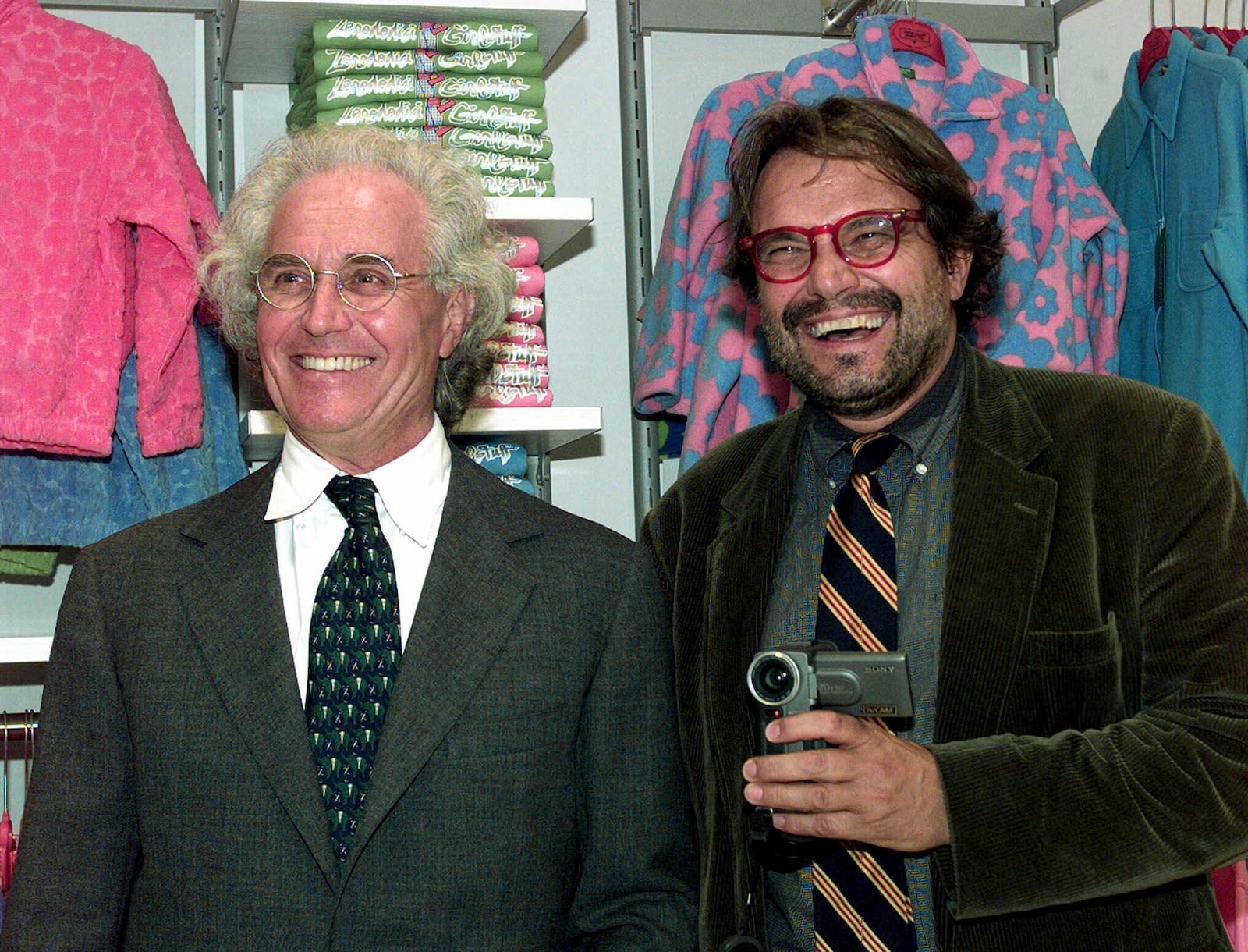 FILE - Luciano Benetton, left, and photographer Oliviero Toscani pose for photographers, in Milan, Italy, on Sept. 29, 1998. (AP Photo/Luca Bruno, File)