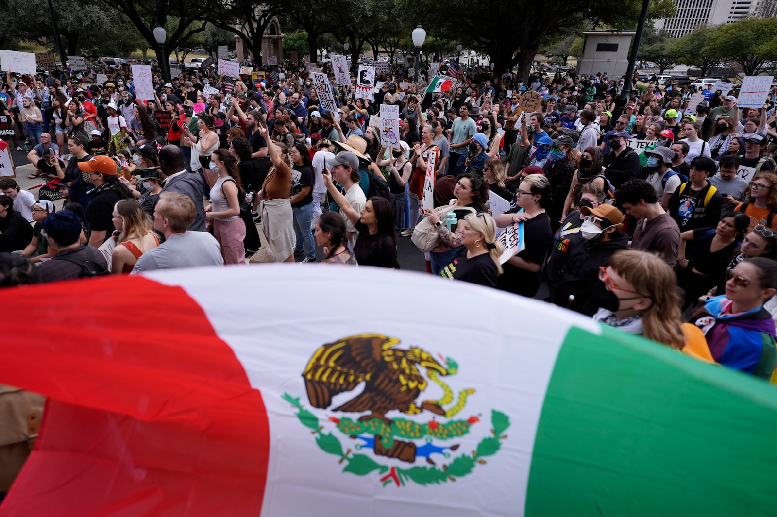 Protesters gather on steps of the Texas Capitol, Wednesday, Feb. 5, 2025, in Austin, Texas. (AP Photo/Eric Gay)