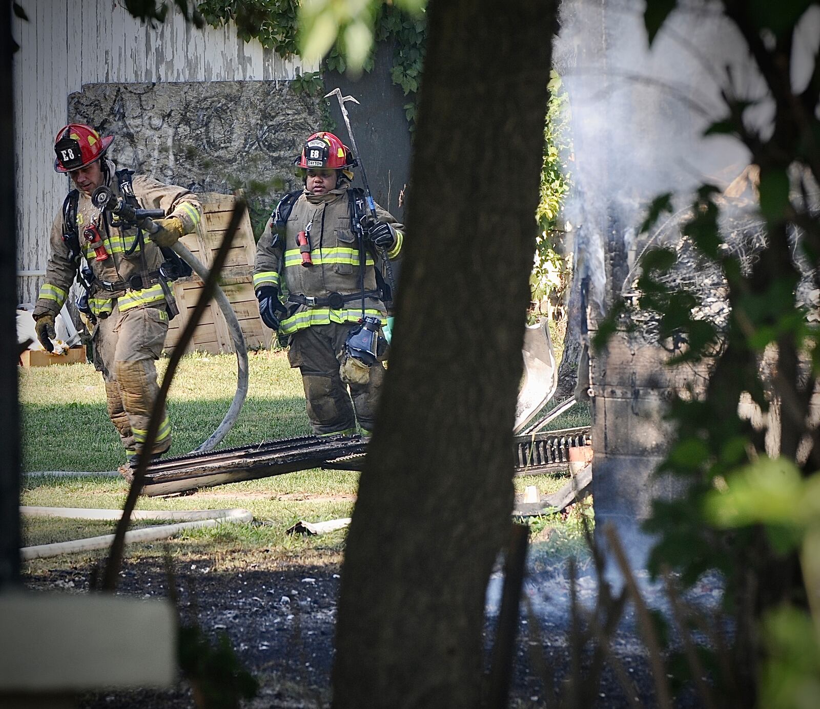 Members of the Dayton Fire Department battle a house, fire on Valley Street Wednesday, Sept. 13, 2023 MARSHALL GORBY \STAFF