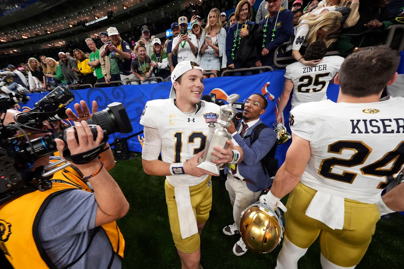 Notre Dame quarterback Riley Leonard (13) celebrates after a quarterfinal game against Georgia in a College Football Playoff, Thursday, Jan. 2, 2025, in New Orleans. (AP Photo/Gerald Herbert)