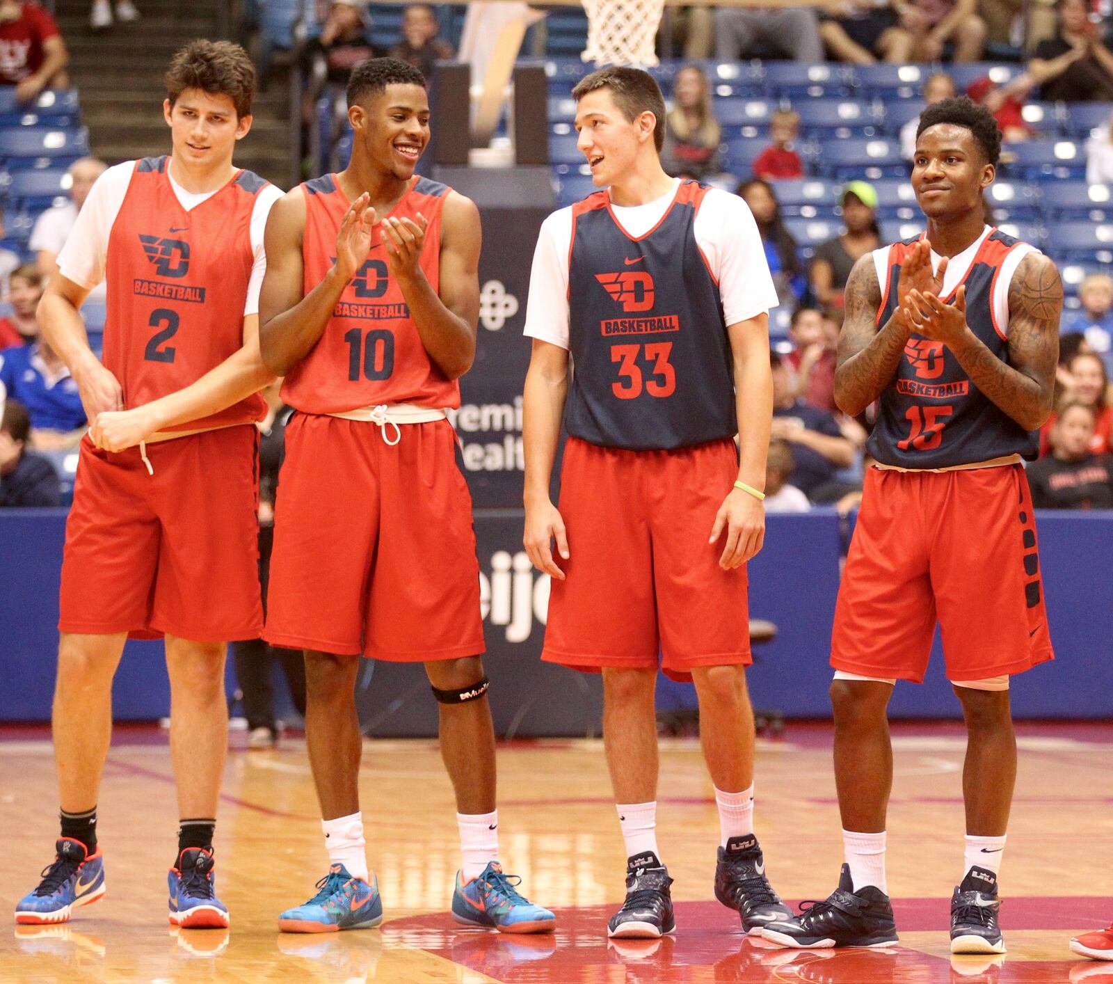 Dayton freshmen (left to right) Sam Miller, Xerius Williams, Ryan Mikesell and John Crosby stand during introductions before the Red and Blue game on Saturday, Oct. 24, 2015, at UD Arena in Dayton. David Jablonski/Staff