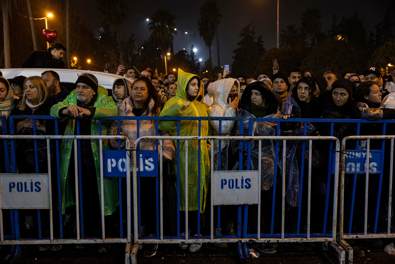 People gather to mark the two-year anniversary of the country's catastrophic earthquake, in Antakya, southern Turkey, early Thursday, Feb. 6, 2025. (Ugur Yildirim/Dia Photo via AP)