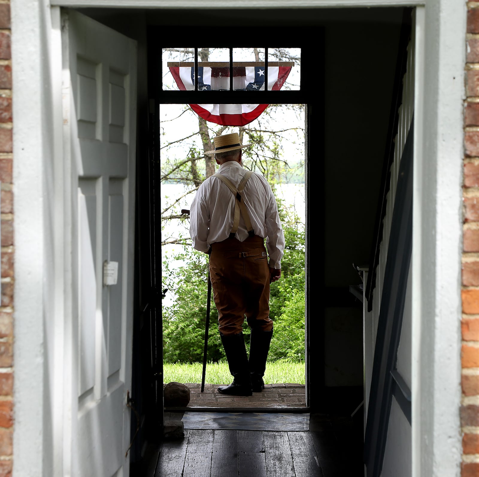 Randy Setty, dressed in period clothing , stands in the doorway of the Crabill Homestead Saturday, May 14, 2022 during an open house celebrating the Clark County Historical Society's taking back management of the 1820s house at CJ Brown Reservoir. BILL LACKEY/STAFF