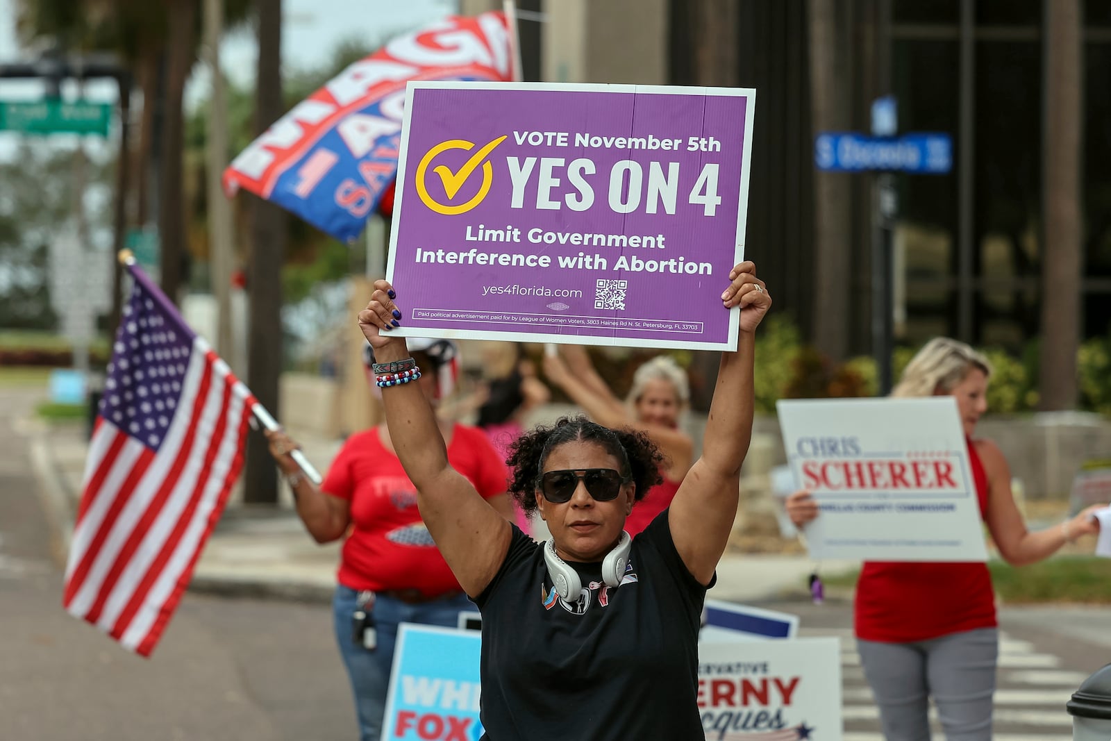 Beth Weinstein rallies in supporter of Yes on Amendment 4 regarding abortion in Florida outside of the polling place at the courthouse on Tuesday, Nov. 5, 2024, in Clearwater, Fla. (AP Photo/Mike Carlson)