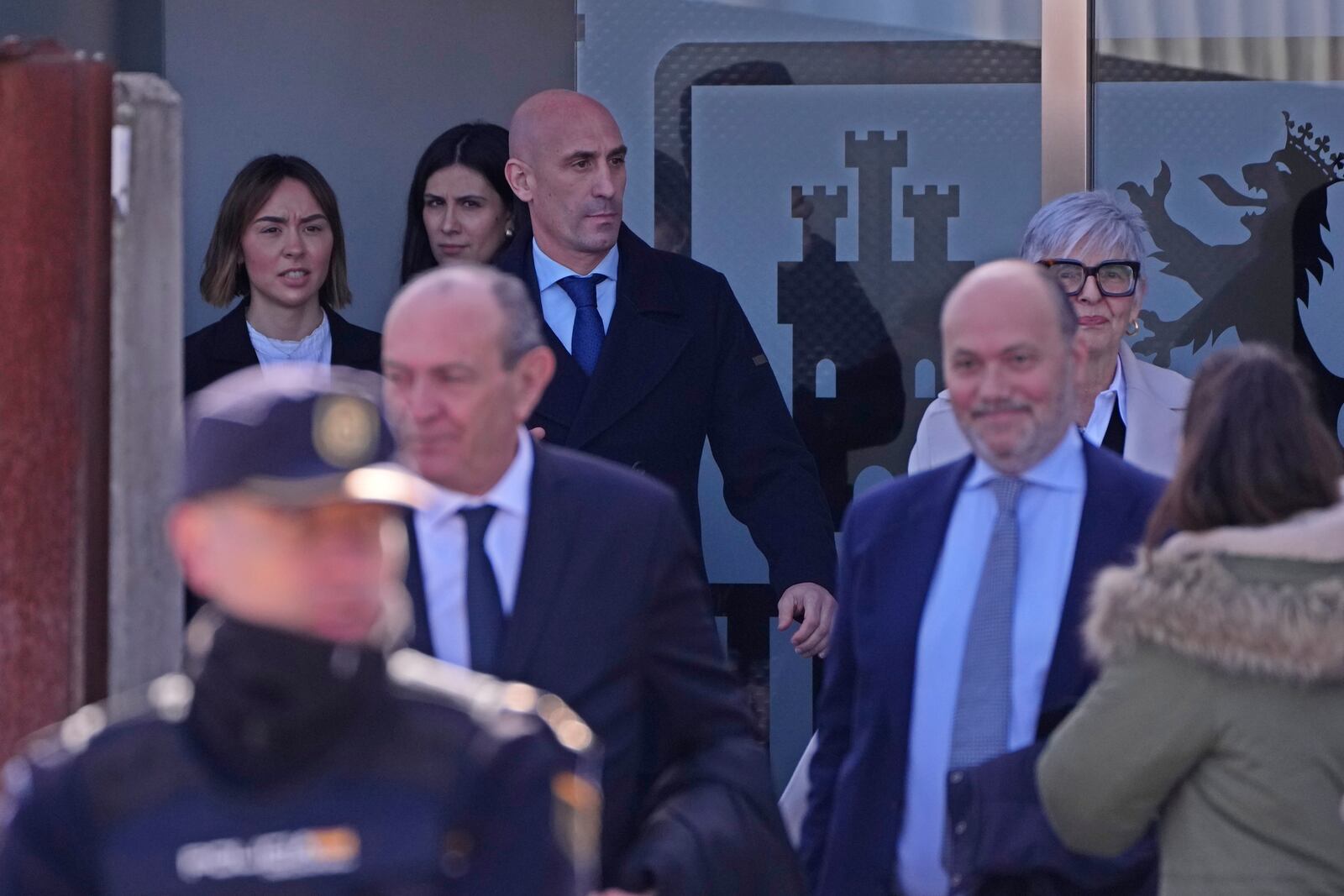 The former president of Spain's soccer federation Luis Rubiales, top, leaves a court on the outskirts of Madrid, Spain, Monday Feb. 3, 2025 where he is on trial for his unsolicited kiss on forward Jenni Hermoso. (AP Photo/Manu Fernandez)