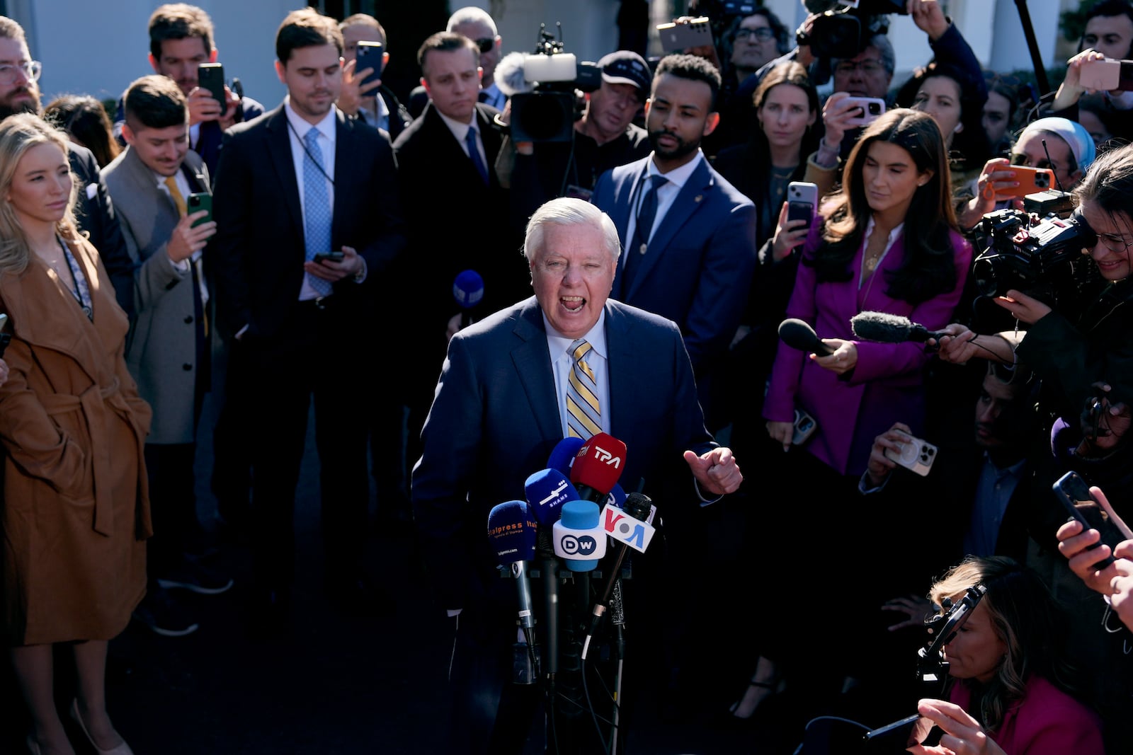 Sen. Lindsey Graham, R-S.C., speaks to reporters outside the West Wing of the White House, Friday, Feb. 28, 2025, in Washington. (AP Photo/Evan Vucci)