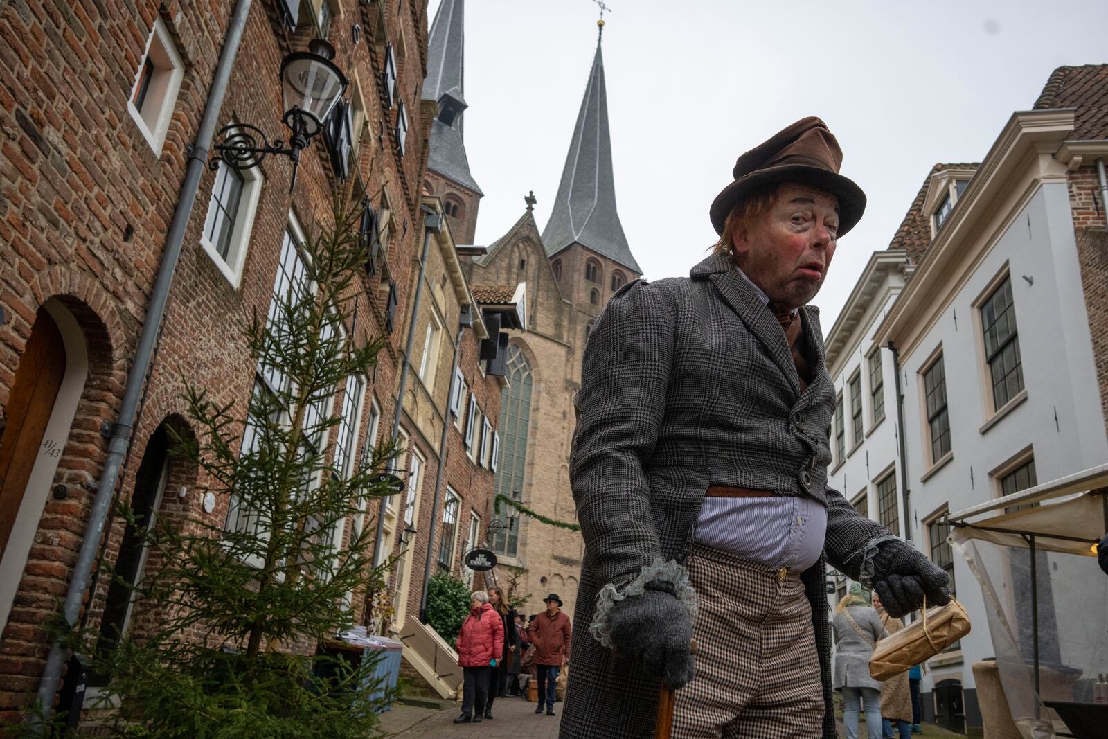 People in costumes from Charles Dickens' 19th-century English era take part in a Dickens Festival, in Deventer, Netherlands, Saturday, Dec. 14, 2024. (AP Photo/Peter Dejong)