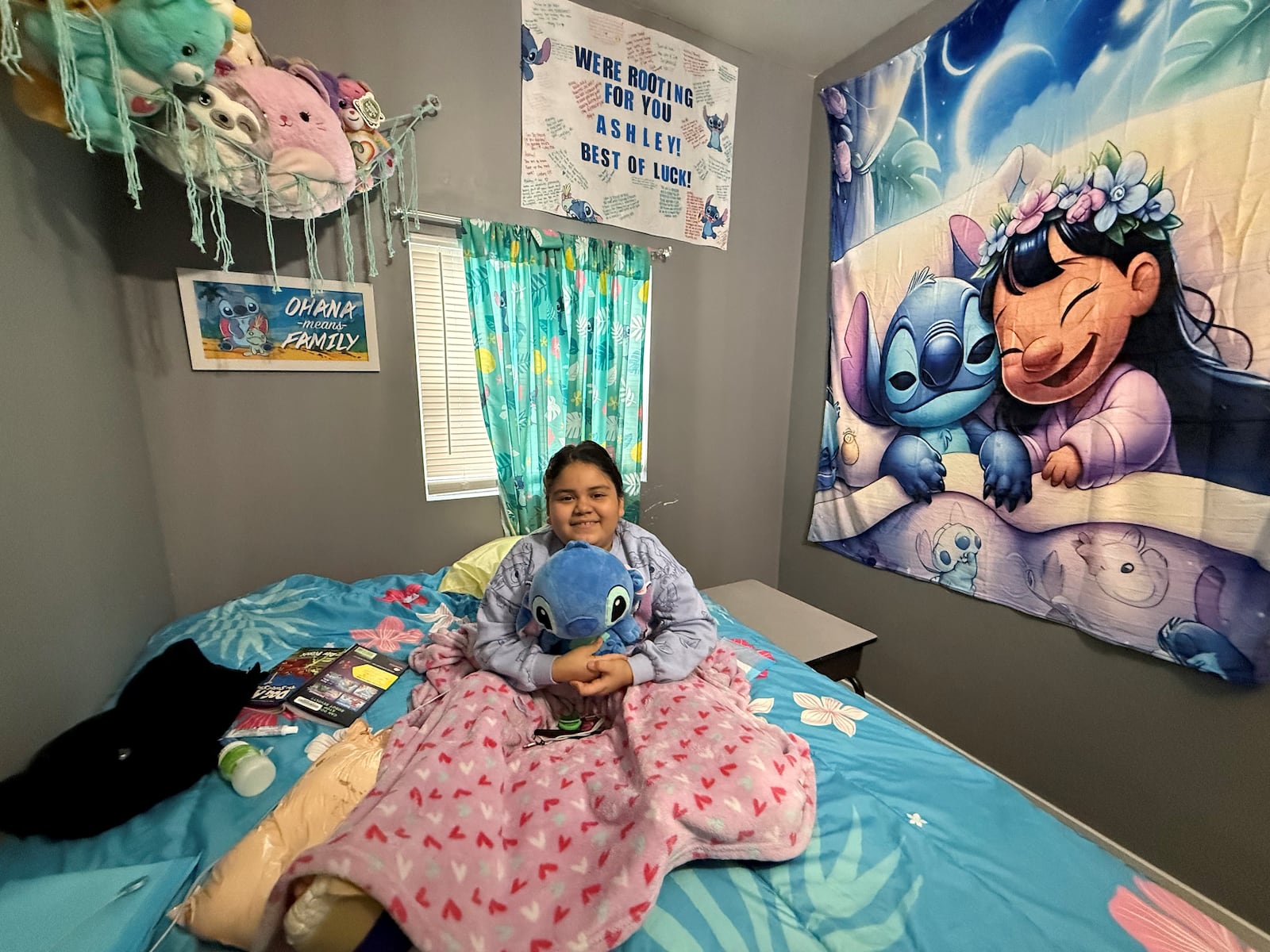 Ashley Escalante, 9, in bed at her East Dayton home on Dec. 18, 2024. Ashley's left foot was amputated after a hit-and-run crash on Wayne Avenue in Dayton on July 22, 2024. Ashley was in the hospital for about 50 days. CORNELIUS FROLIK / STAFF