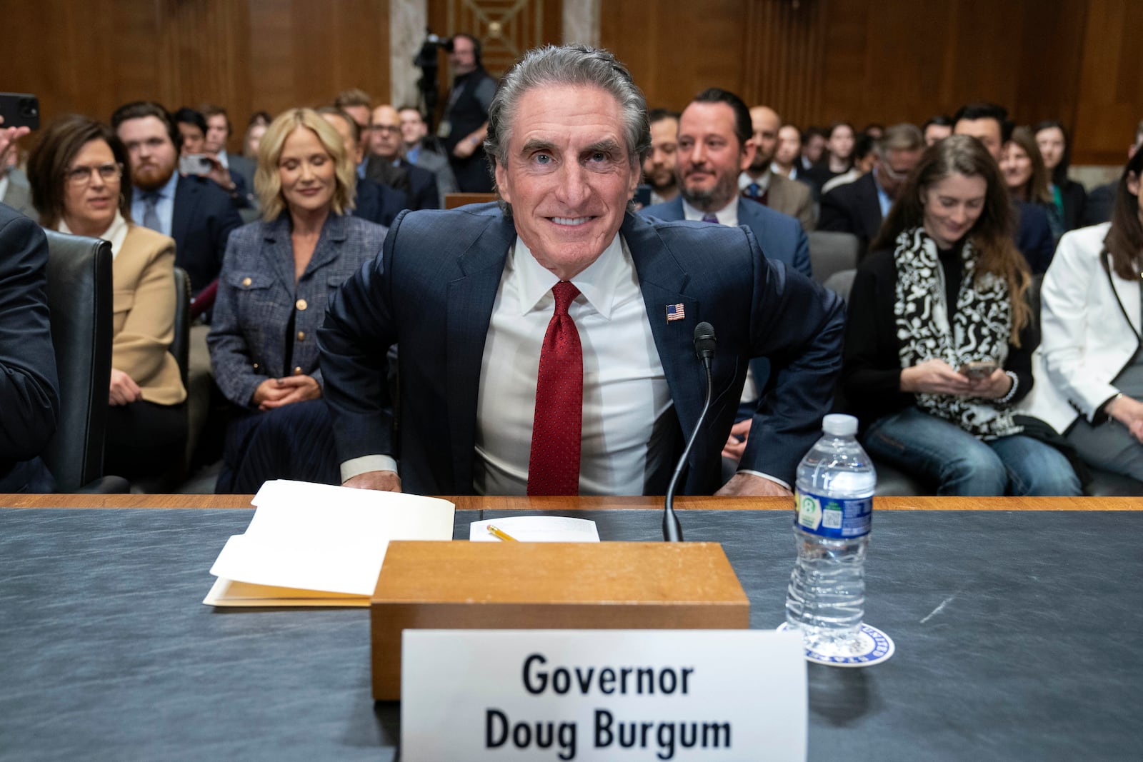 Former Gov. Doug Burgum, President-elect Donald Trump's choice to lead the the Interior Department as Secretary of the Interior, arrives to testify before the Senate Energy and Natural Resources Committee on Capitol Hill in Washington, Thursday, Jan. 16, 2025. (AP Photo/Jose Luis Magana)