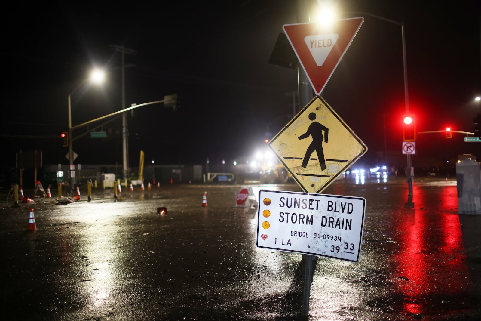 Mud covers Sunset Blvd. in the Palisades Fire zone during a storm Thursday, Feb. 13, 2025, in the Pacific Palisades neighborhood of Los Angeles. (AP Photo/Ethan Swope)