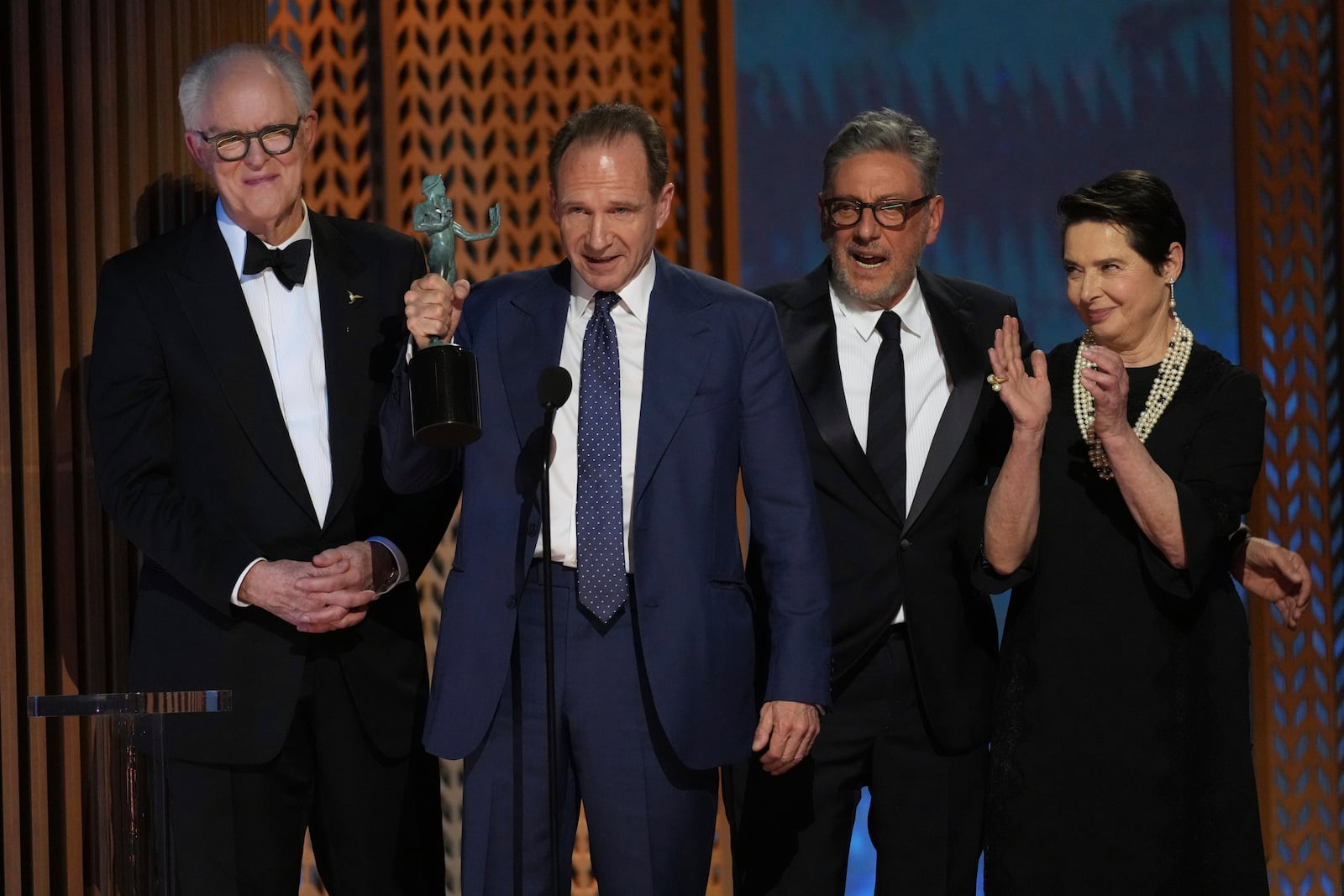 John Lithgow, from left, Ralph Fiennes, Sergio Castellitto, and Isabella Rossellini accepts the award for outstanding performance by a cast in a motion picture for "Conclave" during the 31st annual Screen Actors Guild Awards on Sunday, Feb. 23, 2025, at the Shrine Auditorium in Los Angeles. (AP Photo/Chris Pizzello)