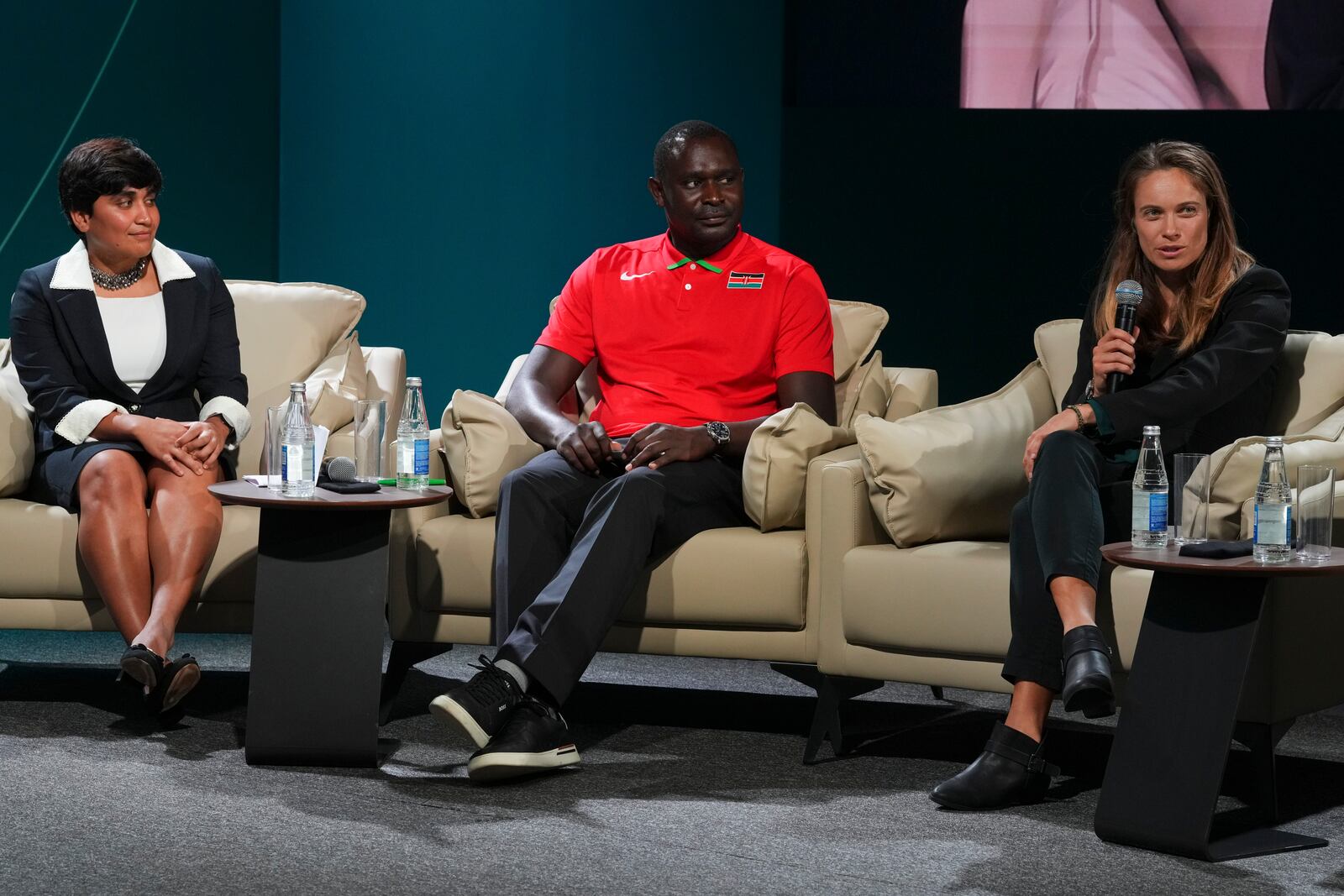 Indian triathlete Pragnya Mohan, from left, David Rudisha, former Kenyan runner, and Katie Rood, New Zealand soccer player, attend a session on sports for climate action during the COP29 U.N. Climate Summit, Monday, Nov. 18, 2024, in Baku, Azerbaijan. (AP Photo/Peter Dejong)