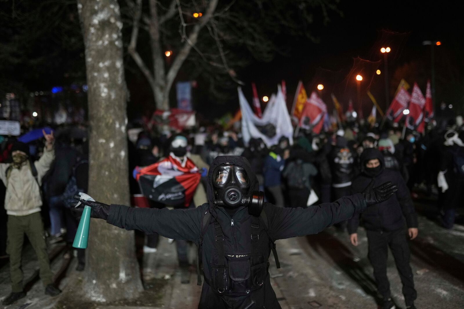 A protester reacts during a protest against the arrest of Istanbul's Mayor Ekrem Imamoglu, in Istanbul, Turkey, Saturday, March 22, 2025. (AP Photo/Francisco Seco)