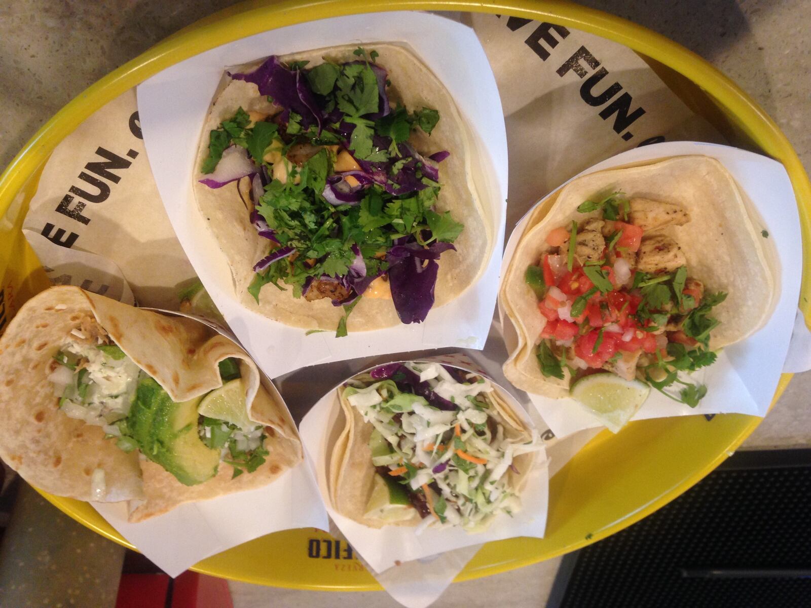 Left to right: chicken fajita taco, BBQ brisket taco, green street taco and baja shrimp taco