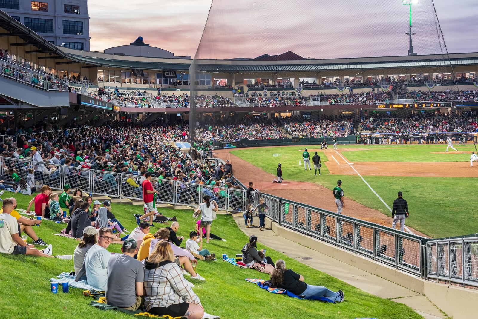 The Dayton Dragons played their home opener on Tuesday, Apr. 11, 2023 at Day Air Ballpark in downtown Dayton to a sellout crowd of 8,135, extending the team’s streak to 1,442 games, an all-time record for professional sports franchises. The Dragons lost to the Great Lakes Loons 9-7. Did we spot you there? TOM GILLIAM/CONTRIBUTING PHOTOGRAPHER