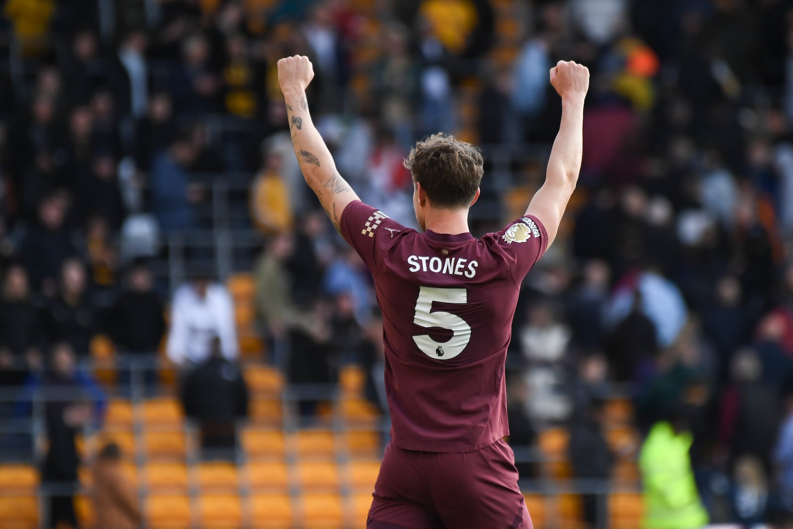 Manchester City's John Stones celebrates after the VAR confirmed his side's second goal during the English Premier League soccer match between Wolverhampton Wanderers and Manchester City at the Molineux Stadium in Wolverhampton, England, Sunday, Oct. 20, 2024. (AP Photo/Rui Vieira)