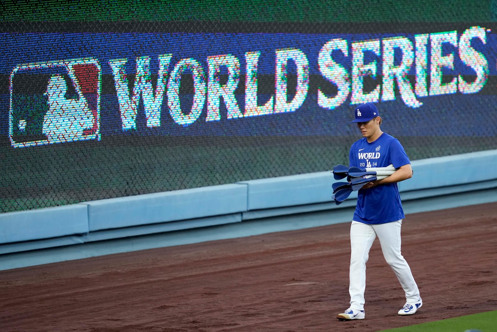 Los Angeles Dodgers pitcher Yoshinobu Yamamoto arrives during batting practice during media day for the baseball World Series against the New York Yankees, Thursday, Oct. 24, 2024, in Los Angeles. (AP Photo/Ashley Landis)