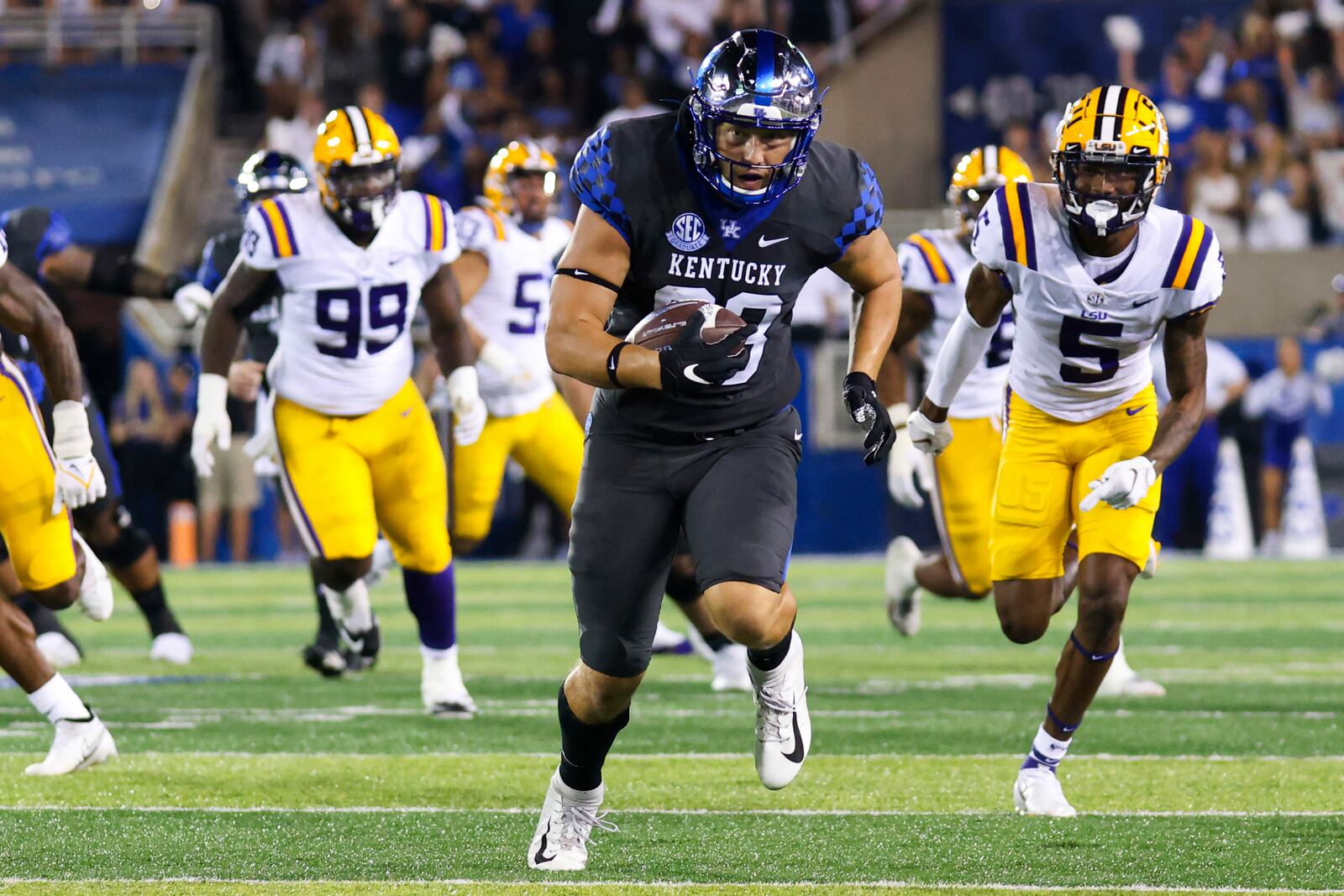 Kentucky tight end Justin Rigg (83) carries the ball during the first half of the team's NCAA college football game against LSU in Lexington, Ky., Saturday, Oct. 9, 2021. (AP Photo/Michael Clubb)