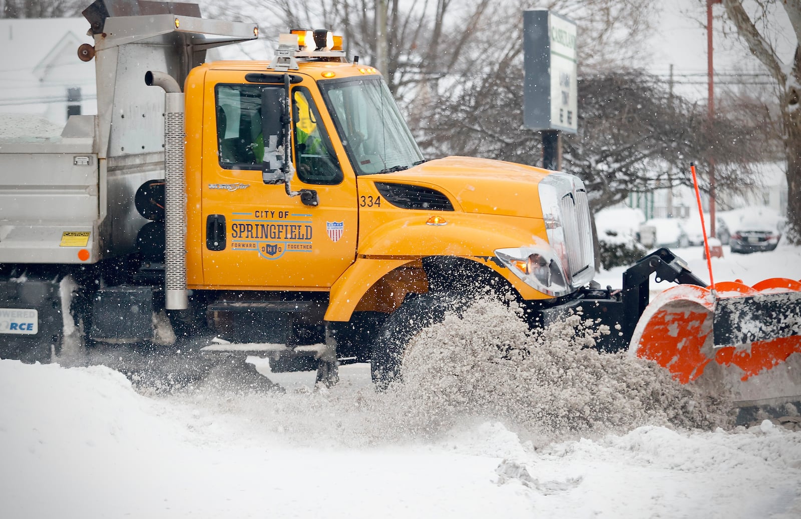 A City of Springfield snow plow works Main Street on Monday morning, Jan. 6, 2025 after heavy snowfall overnight. MARSHALL GORBY / STAFF