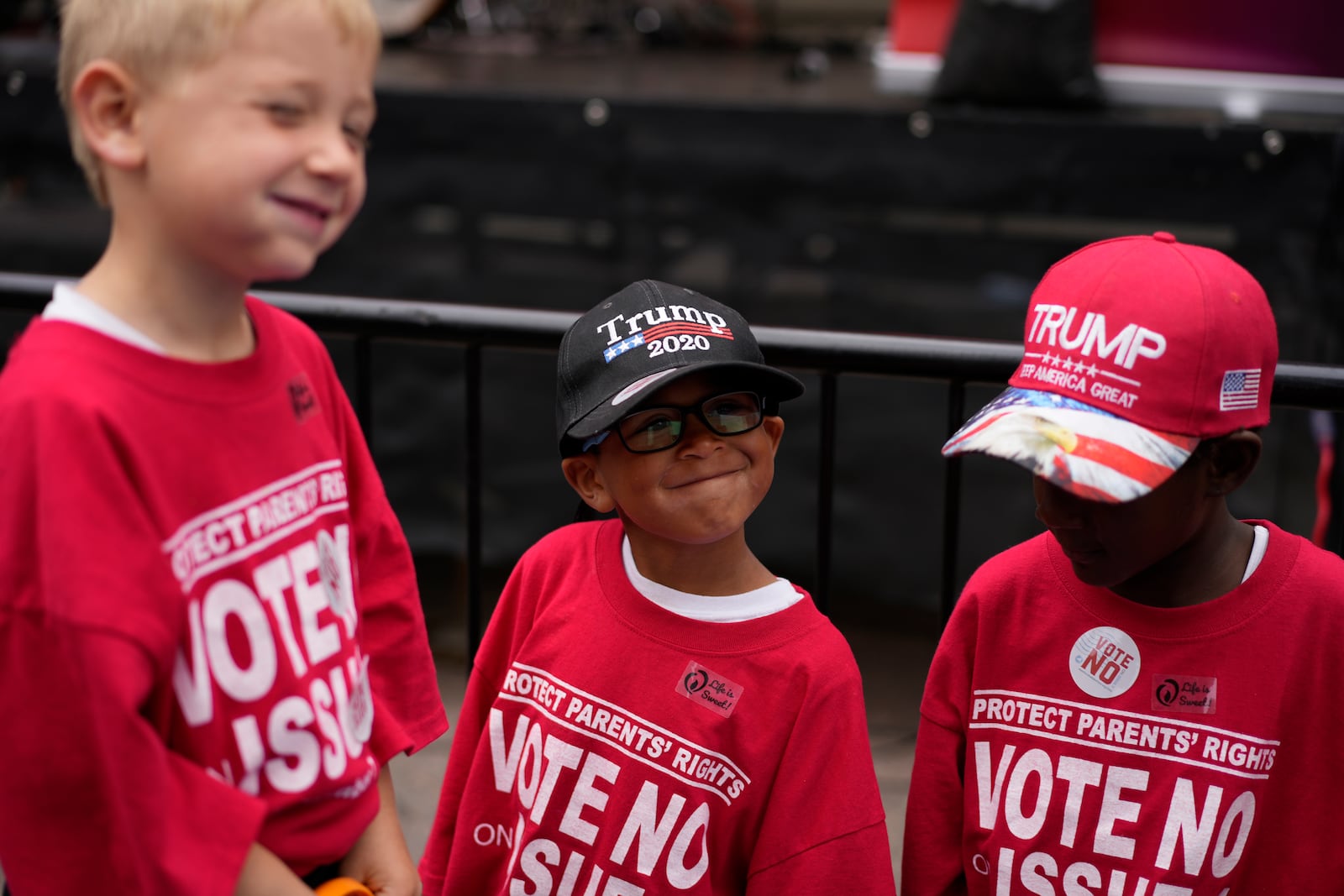 The Young children from left, Isaac, Lucas, and Gianna, attend the Ohio March for Life with their mom, Erin Young, at the Ohio Statehouse in Columbus, Ohio, Friday, Oct. 6, 2023. All three children are adopted. (AP Photo/Carolyn Kaster)