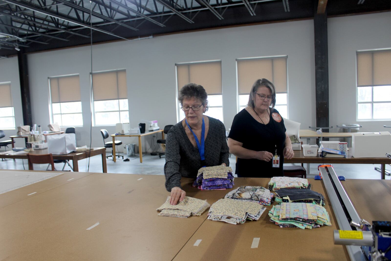 Since Friday, March  20,  Dayton Sewing Collaborative volunteers  in homes around  the community have made hundreds of  reusable face mask for local organization who need them as worries mount of the  coronavirus.  Volunteers Bonnie Craigo (left) is pictured with director Brenda Rex.