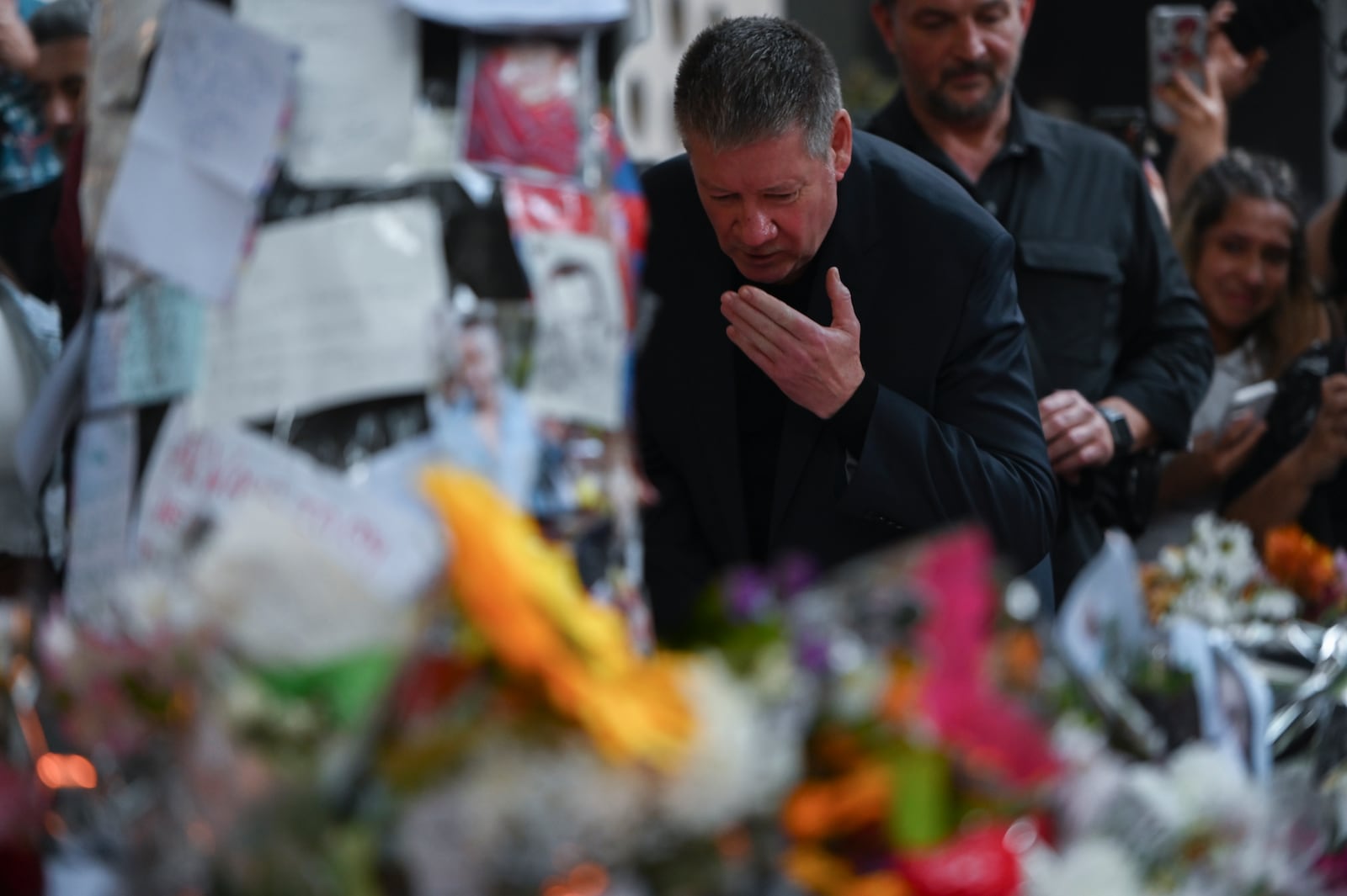 Geoff Payne, the father of former One Direction singer Liam Payne, visits a memorial outside the Casa Sur Hotel where the British pop singer fell to his death from a hotel balcony, in Buenos Aires, Argentina, Friday, Oct. 18, 2024. (AP Photo/Mario De Fina)