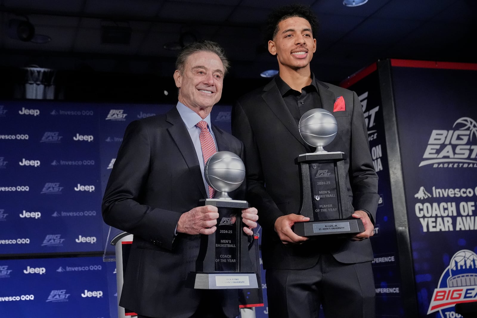 St. John's head coach Rick Pitino, left, poses with RJ Luis Jr. after a news conference at the Big East basketball tournament Wednesday, March 12, 2025, in New York. (AP Photo/Frank Franklin II)