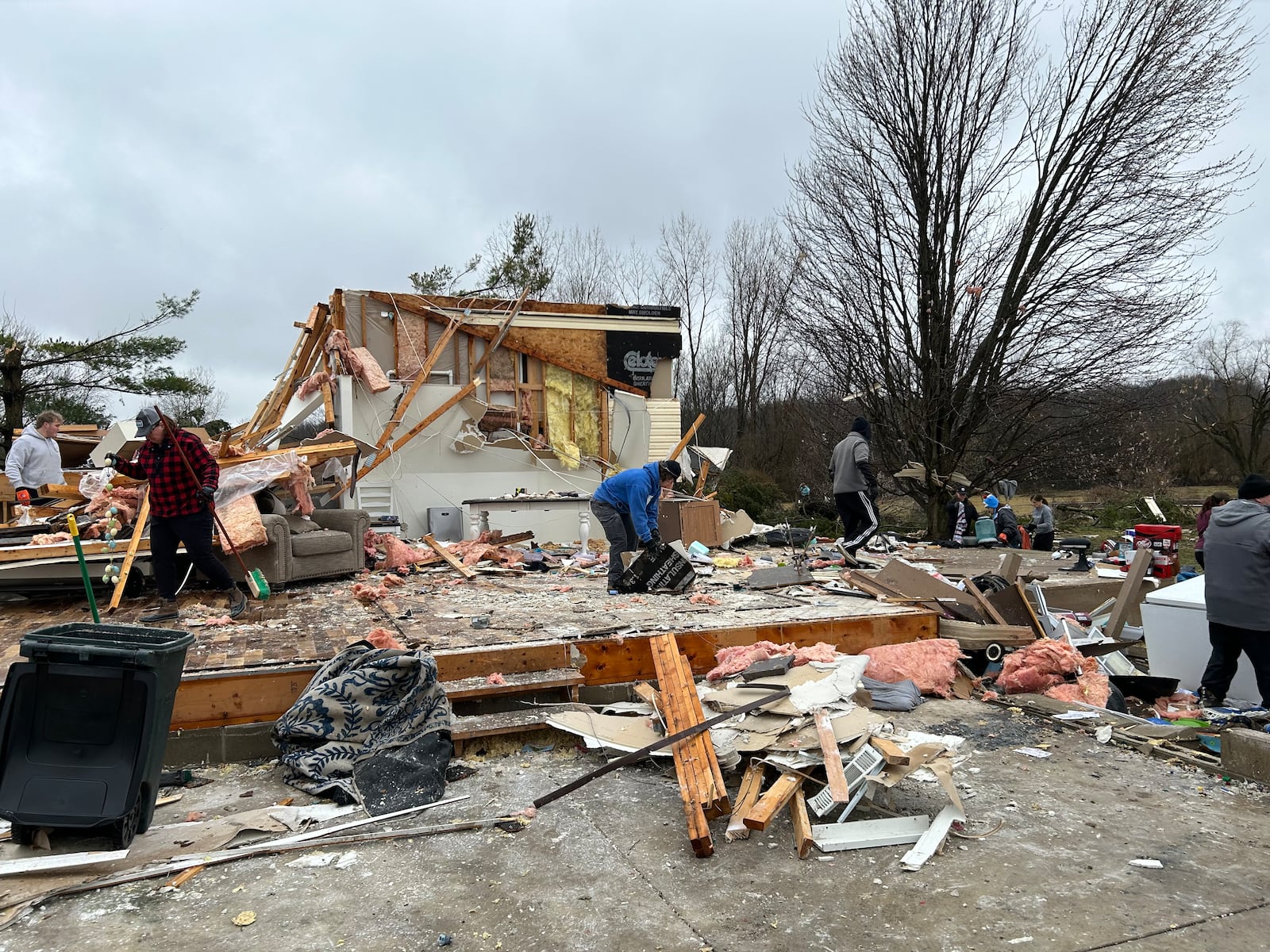 Around 100 people came to the Mitchell Road property of Jon and Rebekah Stewart to help clean their property Saturday morning after they lost nearly everything after a tornado hit on Wednesday.