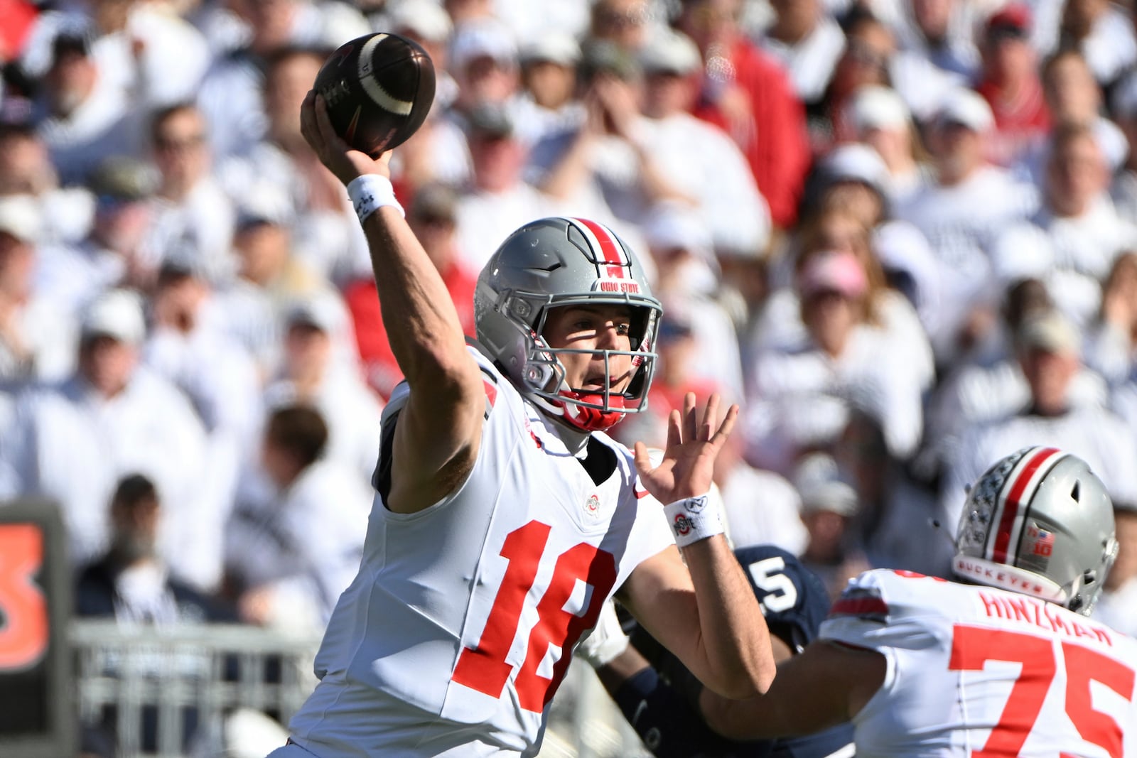 Ohio State quarterback Will Howard (18) throws a pass during the first quarter of an NCAA college football game against Penn State, Saturday, Nov. 2, 2024, in State College, Pa. (AP Photo/Barry Reeger)