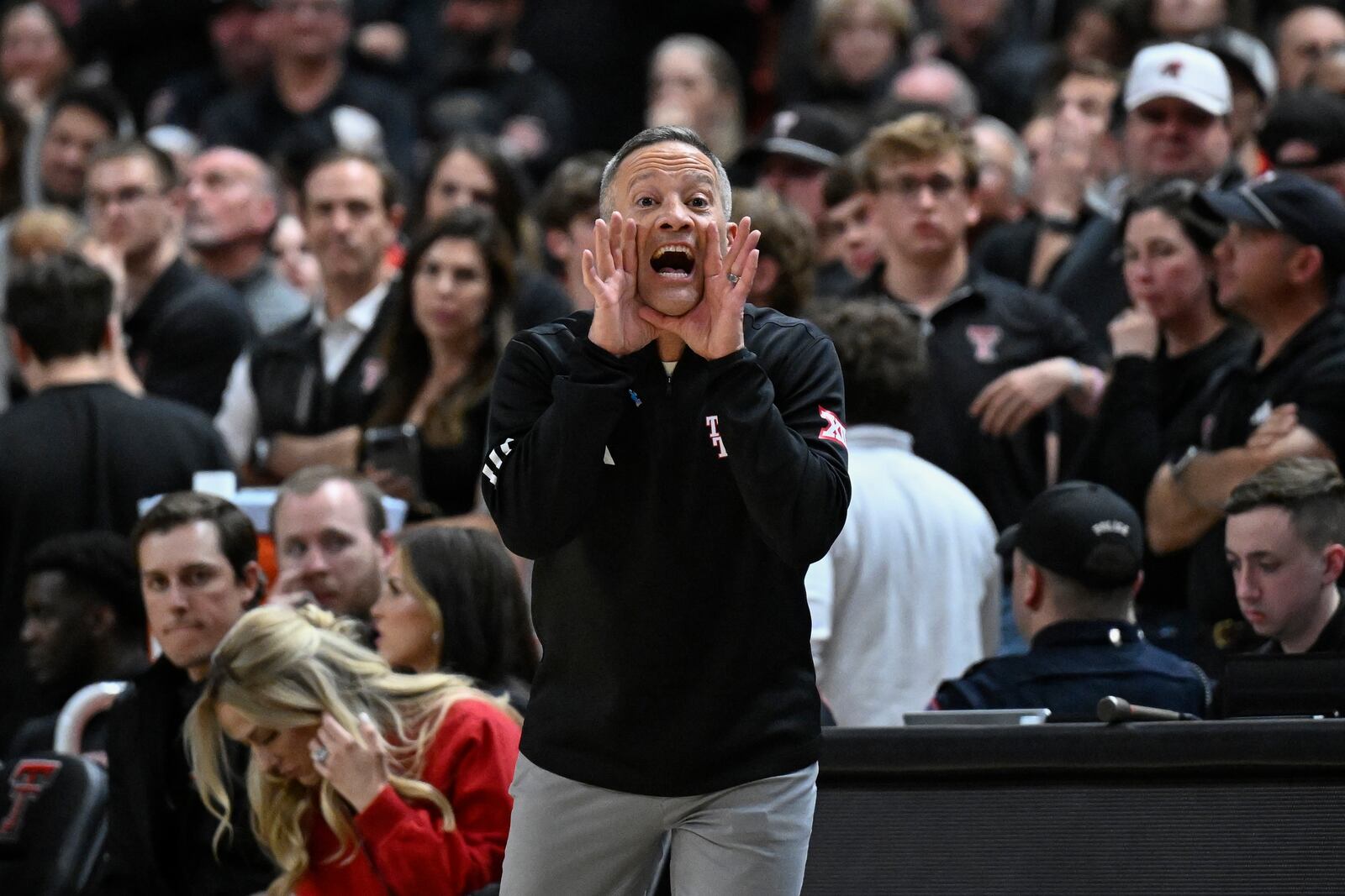 Texas Tech head coach Grant McCasland calls out to players from the sideline during the second half of an NCAA college basketball game against Houston, Monday, Feb. 24, 2025, in Lubbock, Texas. (AP Photo/Justin Rex)