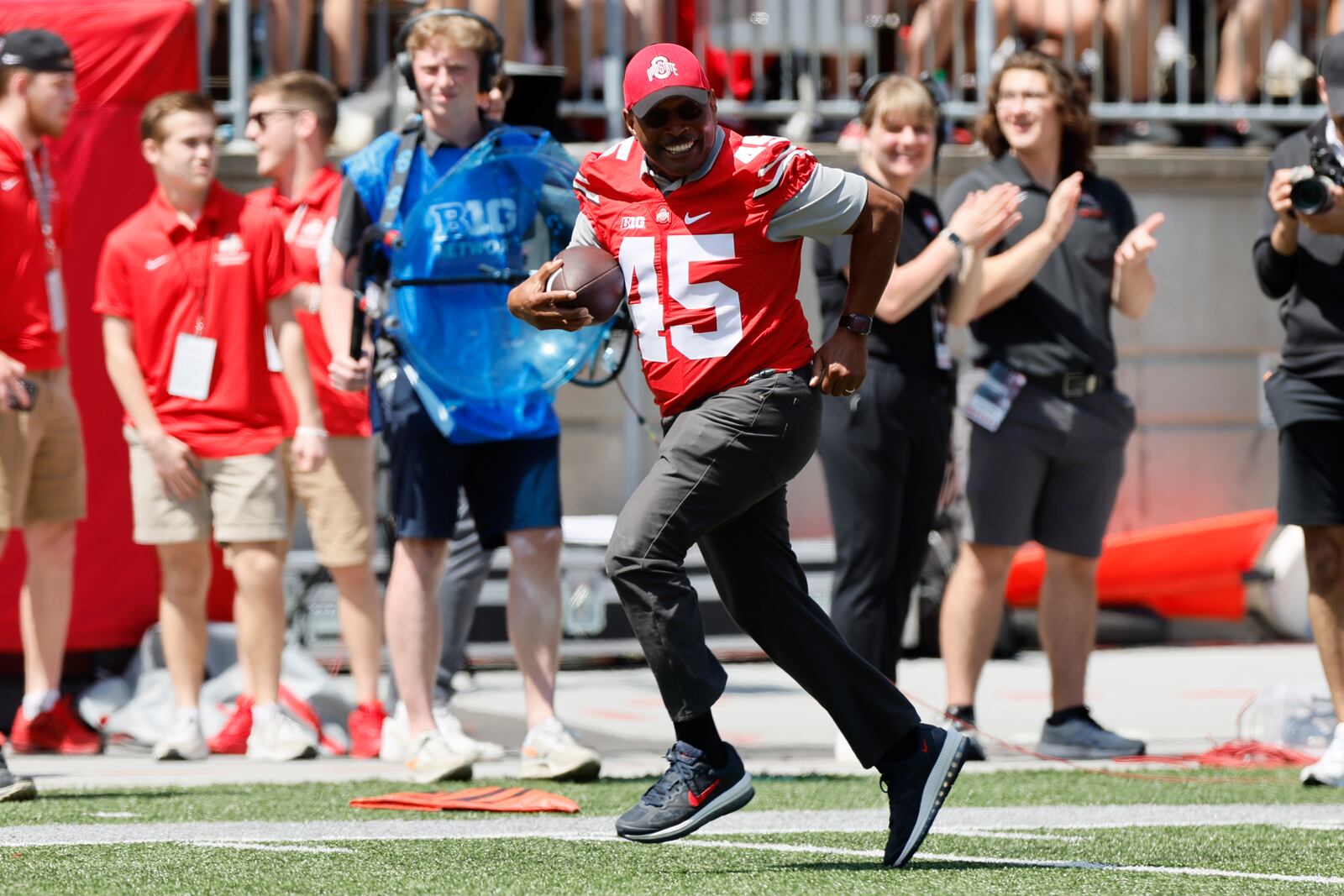 Archie Griffin runs for a touchdown during a ceremonial play during Ohio State's NCAA college football Spring game Saturday, April 15, 2023, in Columbus, Ohio. (AP Photo/Jay LaPrete)