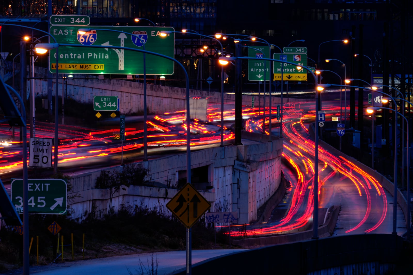 FILE - In this photo made with a long exposure, motor vehicles move along Interstate 76 ahead of the Thanksgiving Day holiday in Philadelphia, Nov. 22, 2023. (AP Photo/Matt Rourke, File)