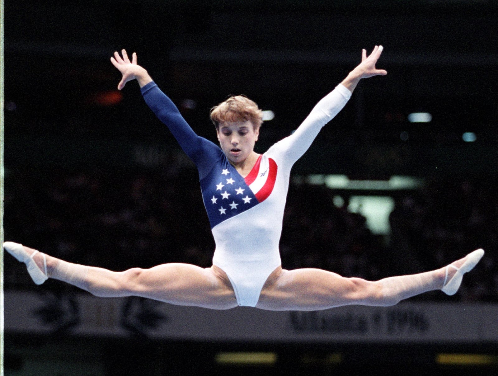  Kerri Strug of the U.S. women's gymnastics team on the balance beam Tuesday, July 23, 1996 at the Georgia World Congress Center during the 1996 Summer Olympic Games in Atlanta, Georgia. (AJC Staff Photo/Marlene Karas) 7/96