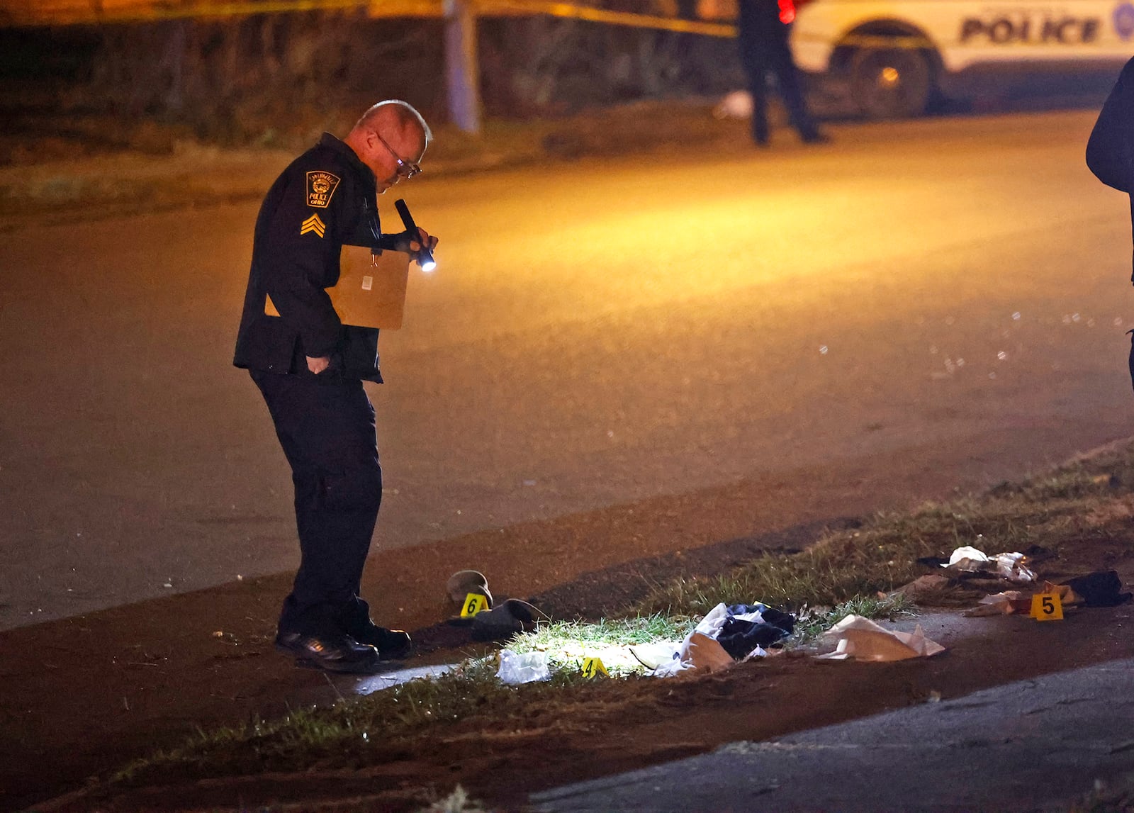 The Springfield Police Division investigates the scene of a shooting along the 600 block of Euclid Avenue Thursday evening, Dec. 21, 2023. According to police they arrived to find a male laying beside the road with a gunshot wound to the head. The victim was transported to Springfield Regional Medical Center and flown by CareFlight to Miami Valley Hospital. BILL LACKEY/STAFF