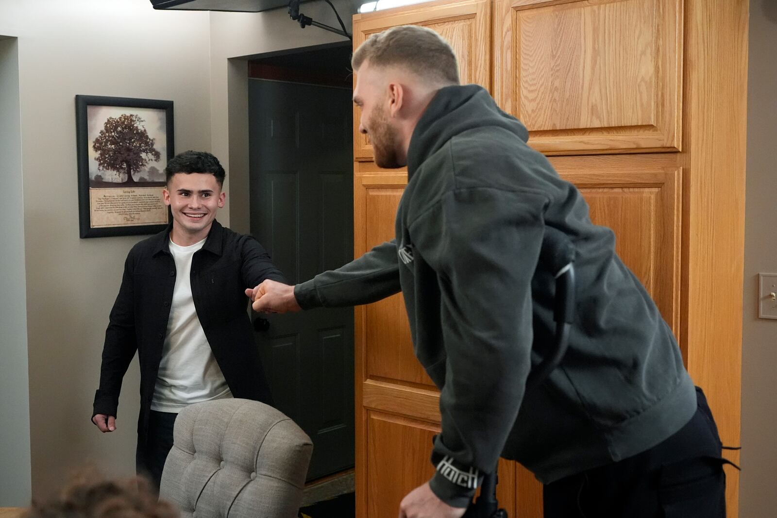 Detroit Lions' Aidan Hutchinson visits with Jacob Rinehart, Thursday, Nov. 14, 2024, in Chesterfield Township, Mich. (AP Photo/Carlos Osorio)