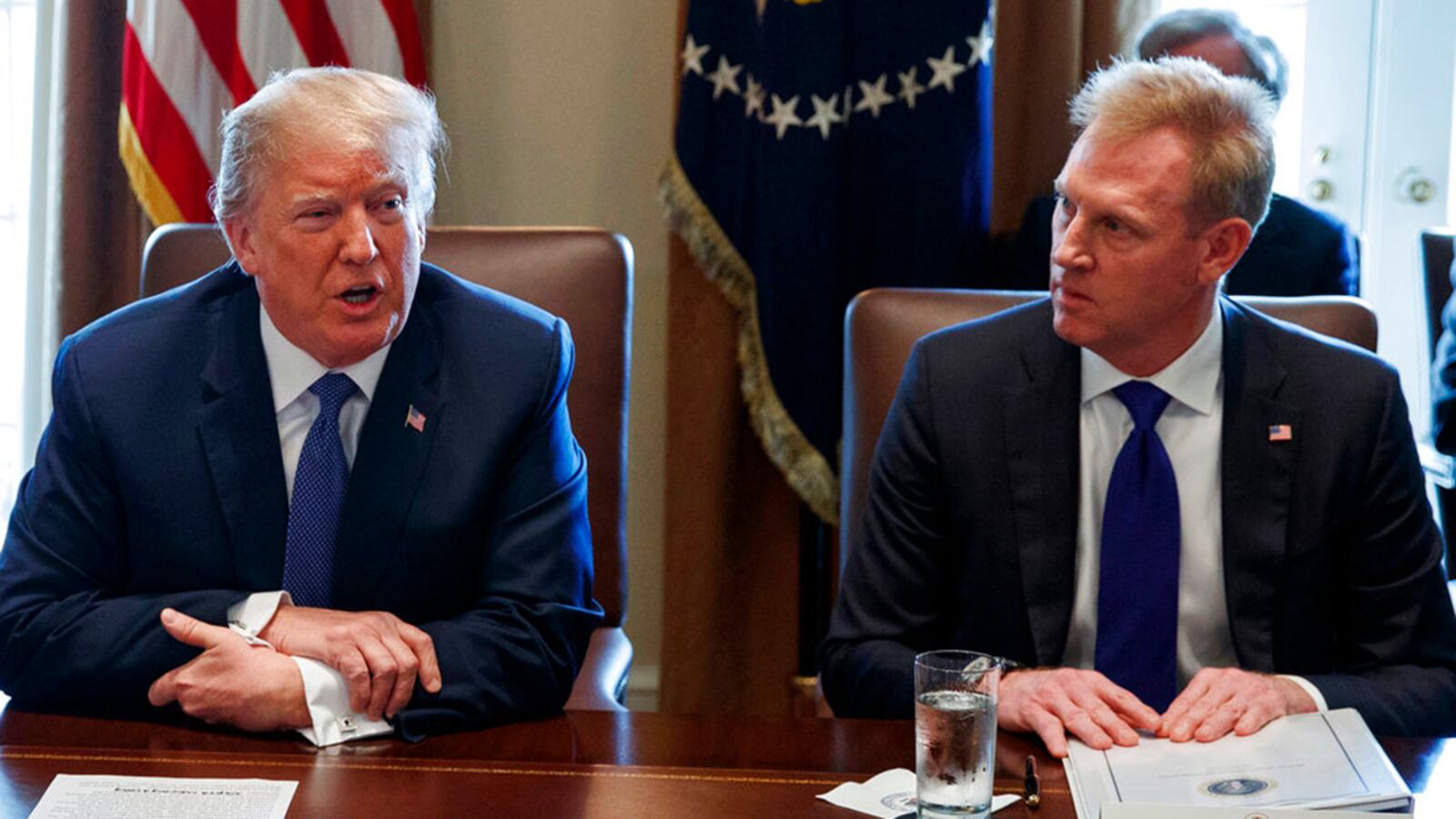 FILE - In this April 9, 2018, file photo, Deputy Secretary of Defense Patrick Shanahan, right, listen as President Donald Trump speaks during a cabinet meeting at the White House, in Washington. A U.S. administration official says that Defense Secretary Jim Mattis will leave his post Jan. 1, 2019, as Trump is expected to name Shanahan as acting secretary.