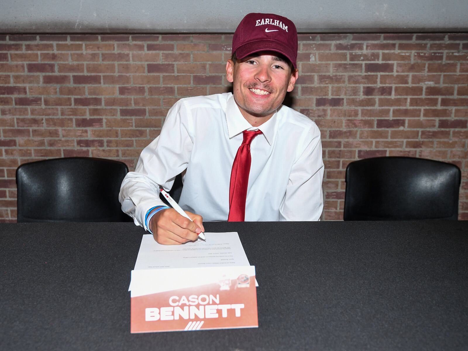 Cason Bennett signs to play baseball at Earlham College at a Cincinnati Reds Youth Academy press conference on Monday, June 6, 2022, in Cincinnati. Photo courtesy of Reds