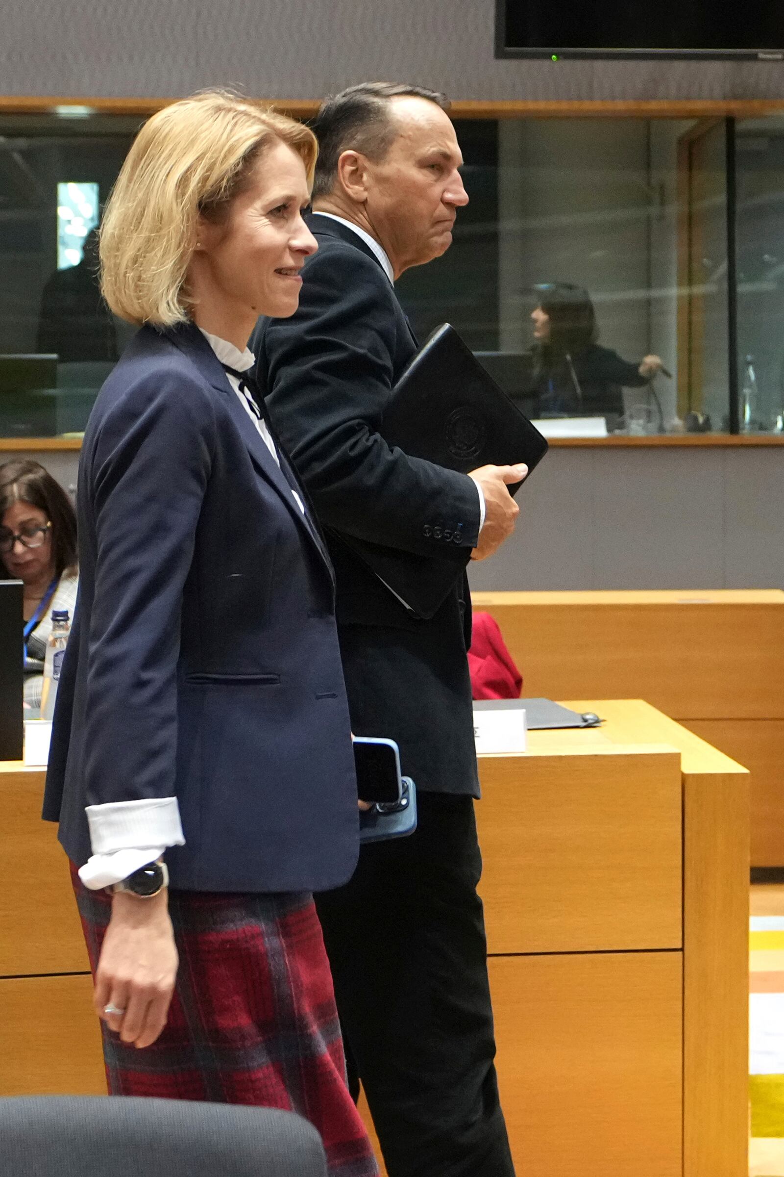 European Union foreign policy chief Kaja Kallas, left, and Poland's Foreign Minister Radoslaw Sikorski arrive for a round table meeting of EU foreign ministers at the European Council building in Brussels, Monday, Jan. 27, 2025. (AP Photo/Virginia Mayo)