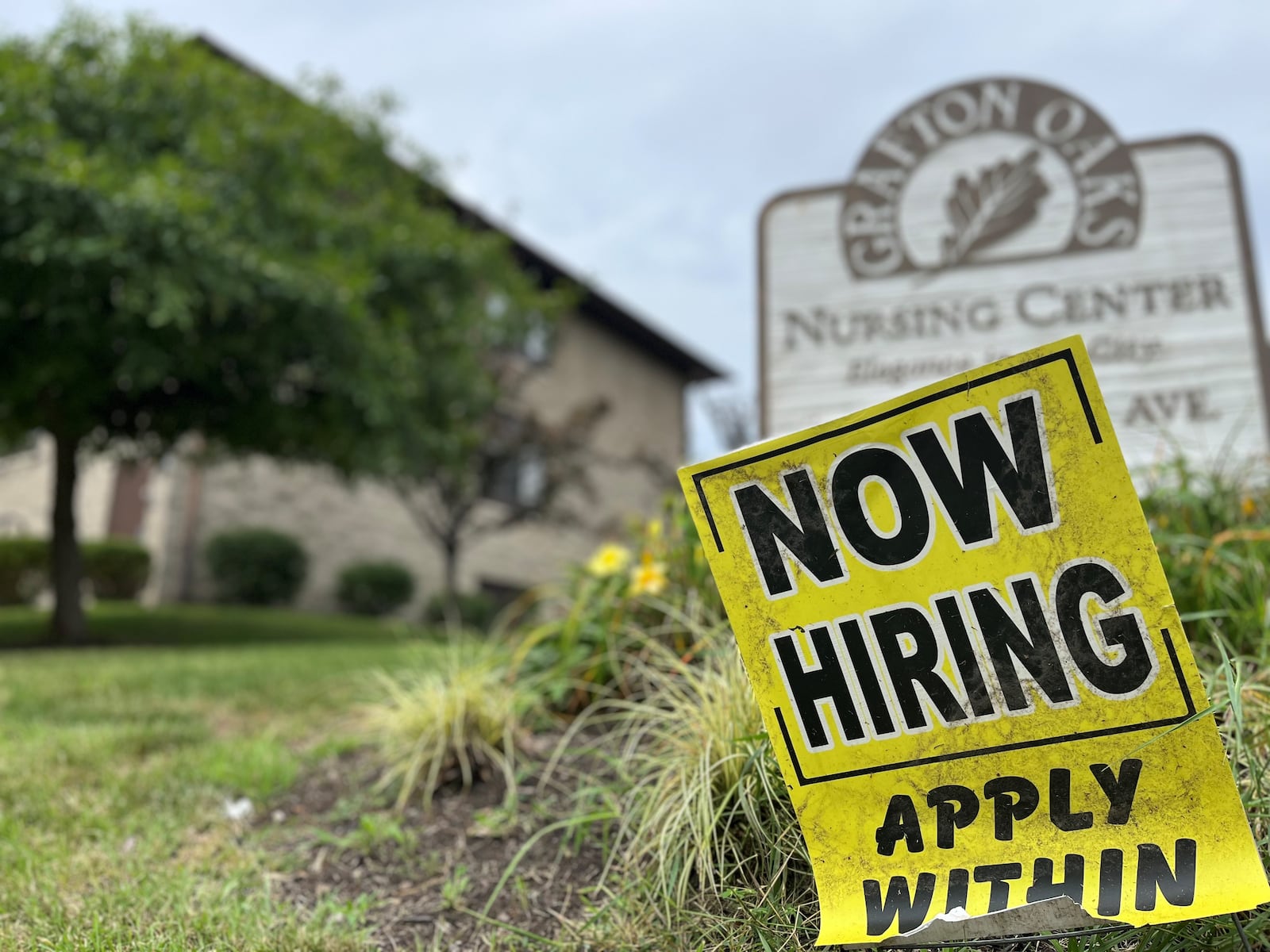 A "now hiring" sign in the Grafton Hills neighborhood in Dayton. CORNELIUS FROLIK / STAFF