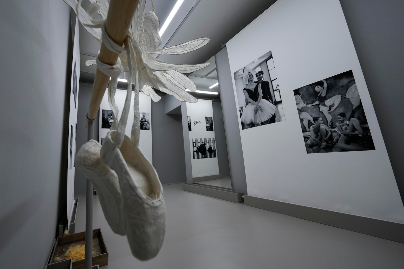 Pictures are displayed during the unveiling of the photo exhibition 'Lo sguardo nascosto' ( The hidden gaze) by photographer Gerard Uferas, at the La Scala Opera House in Milan, Italy, Tuesday, Feb. 11, 2025. (AP Photo/Luca Bruno)