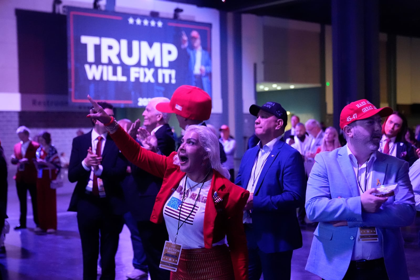 Supporters react as they watch election results at an election night campaign watch party for Republican presidential nominee former President Donald Trump Tuesday, Nov. 5, 2024, in West Palm Beach, Fla. (AP Photo/Alex Brandon)